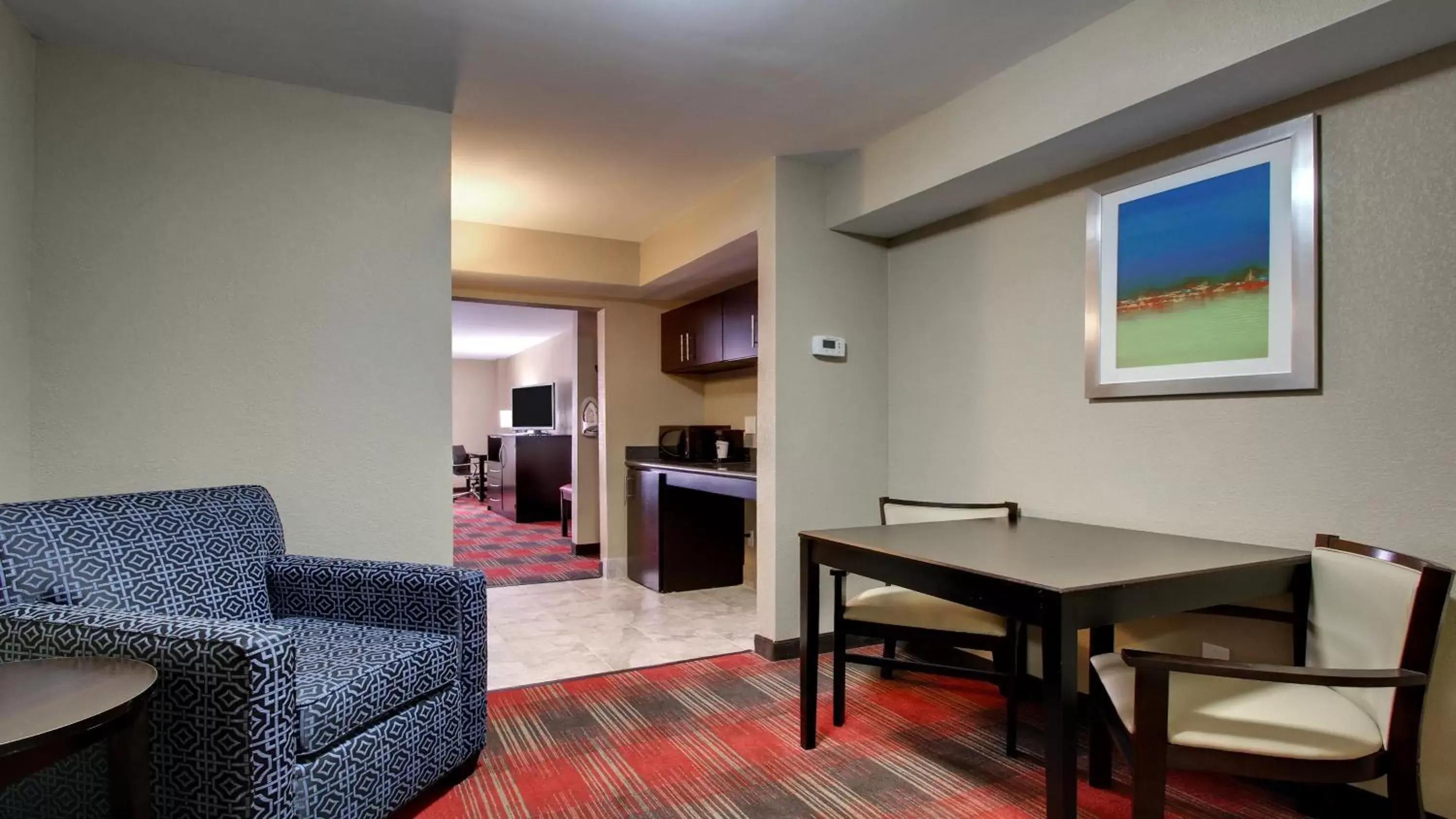 Bedroom, Seating Area in Holiday Inn Express & Suites Jackson Downtown - Coliseum, an IHG Hotel