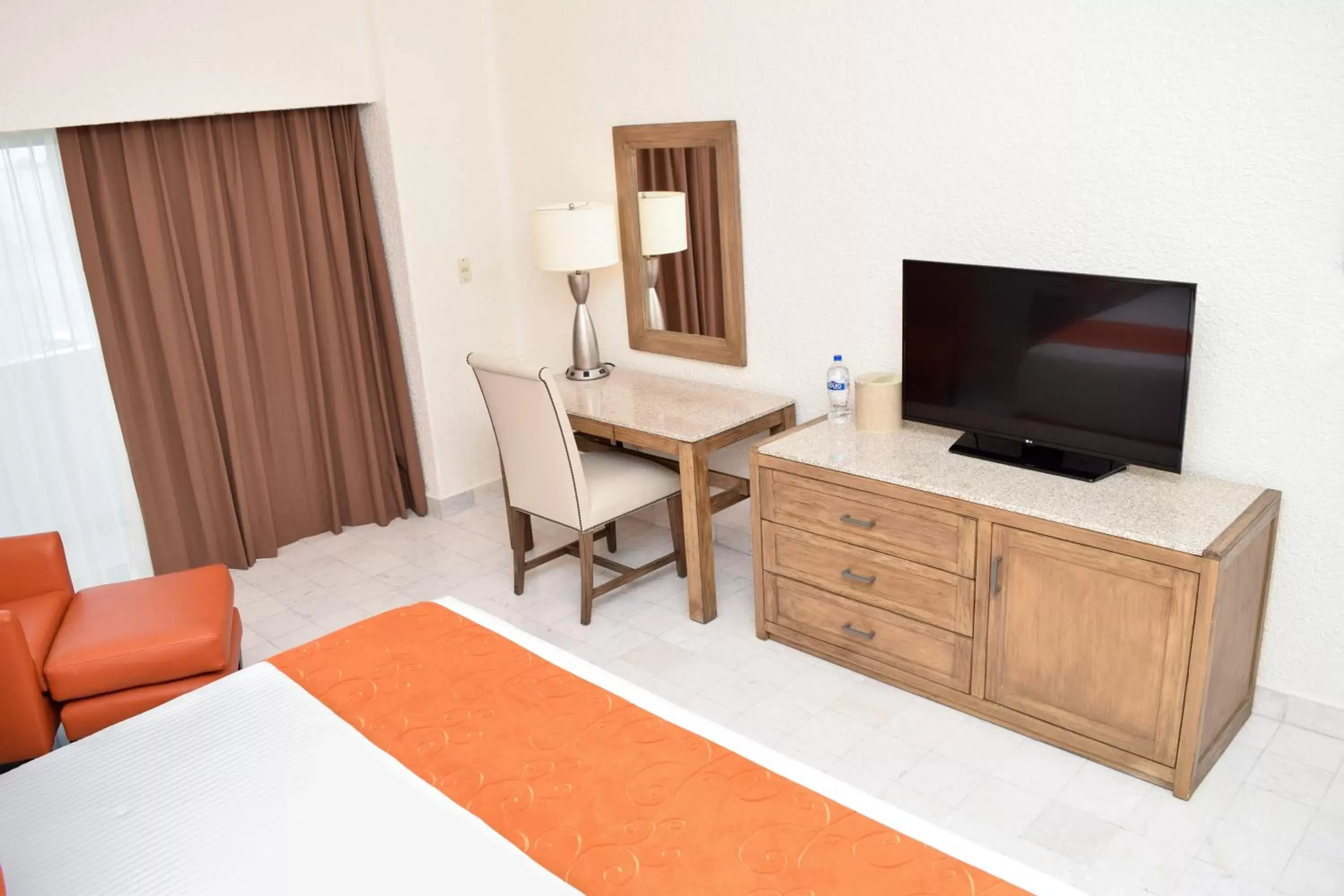 Photo of the whole room, TV/Entertainment Center in Tesoro Manzanillo All Inclusive