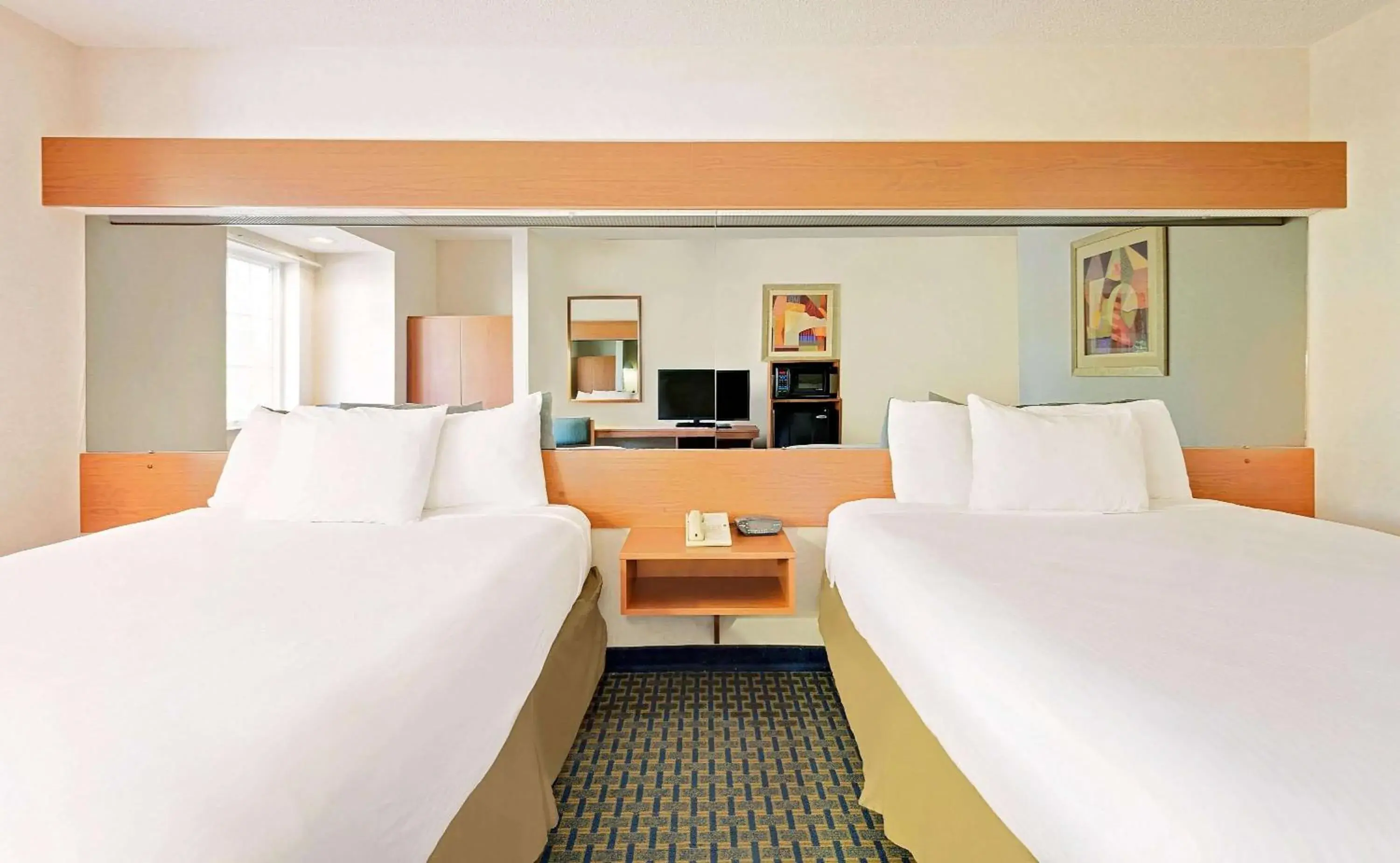 Photo of the whole room, Bed in Microtel Inn by Wyndham Winston-Salem