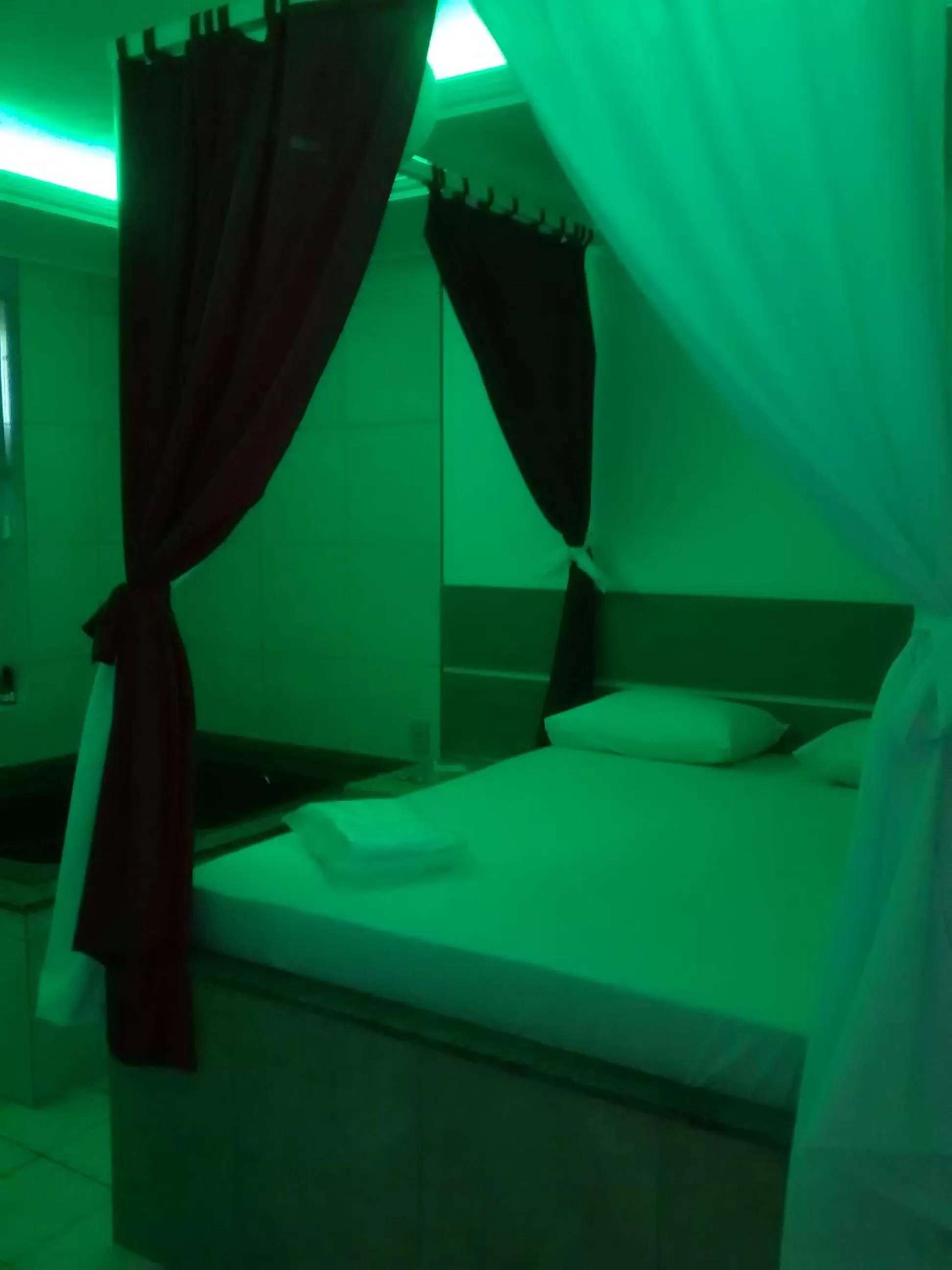 Bedroom in Classic Hotel e Motel