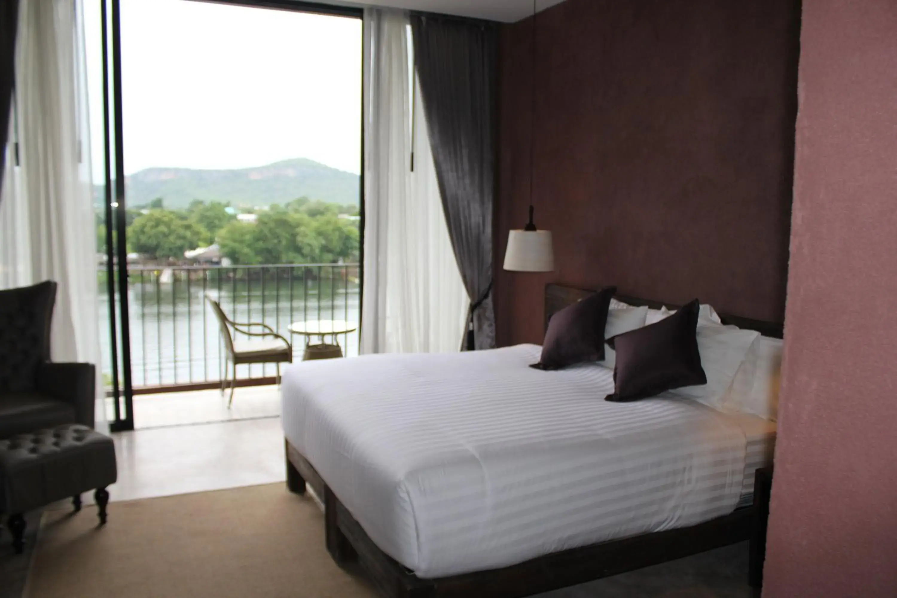 Bed in The Glory River Kwai Hotel