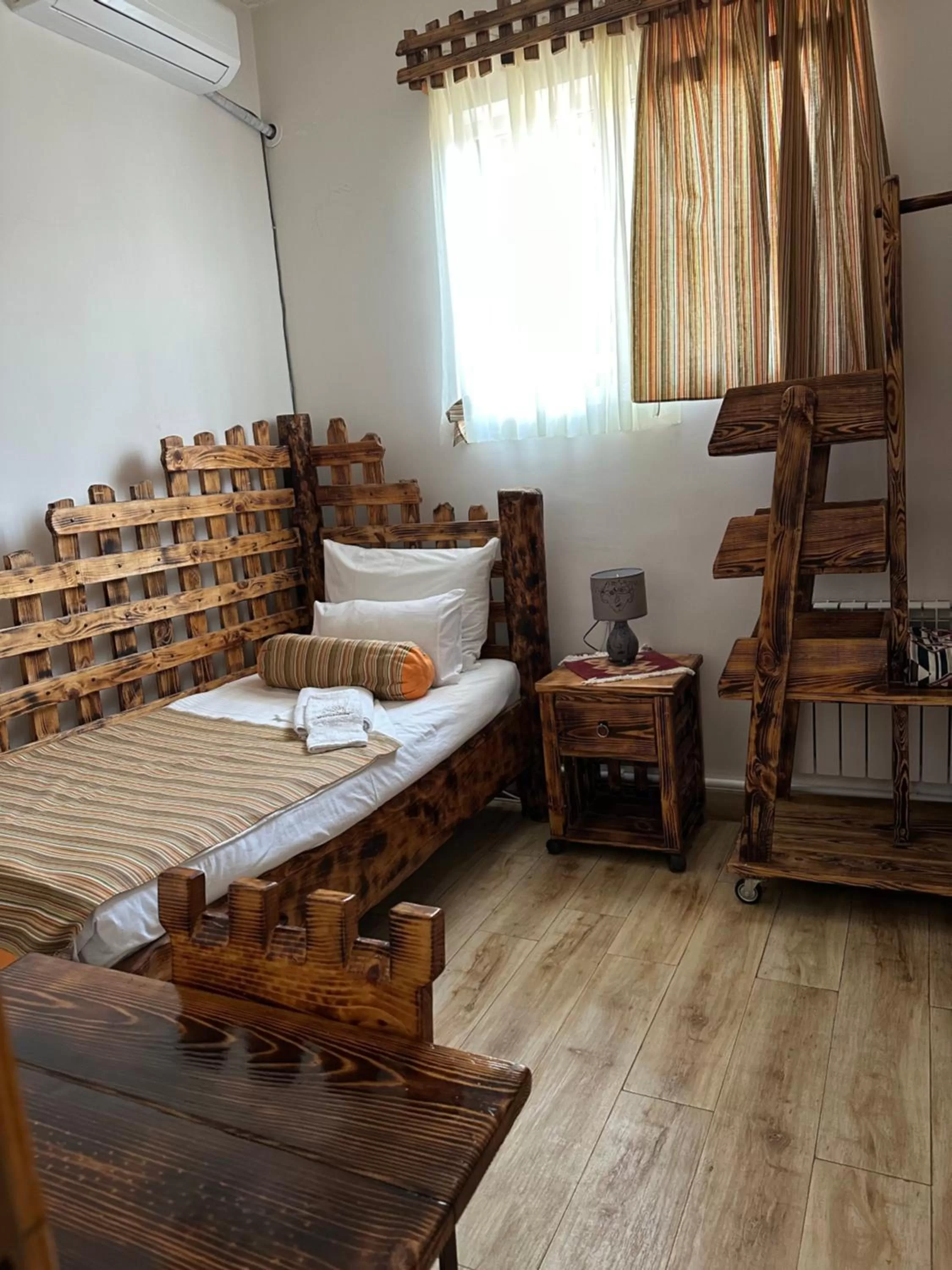 Bed in Machanents Art Hotel