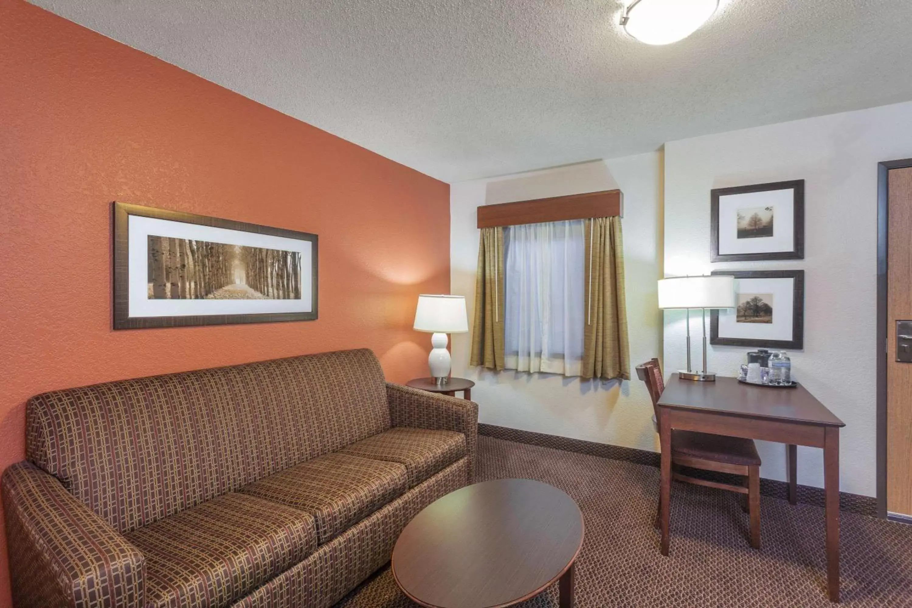 Living room, Seating Area in AmericInn by Wyndham White Bear Lake St. Paul