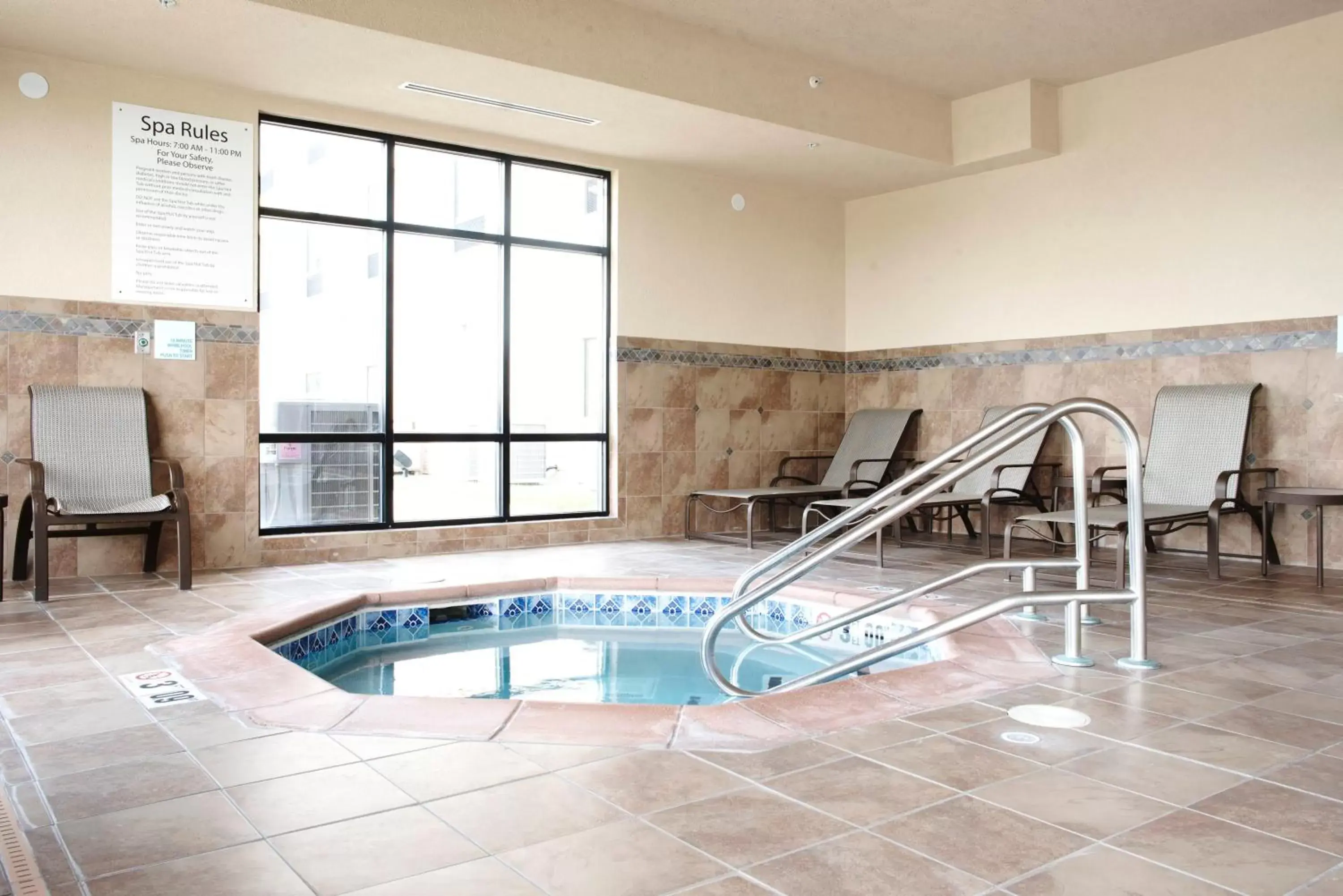 Lobby or reception, Swimming Pool in Holiday Inn Express and Suites Urbandale Des Moines, an IHG Hotel