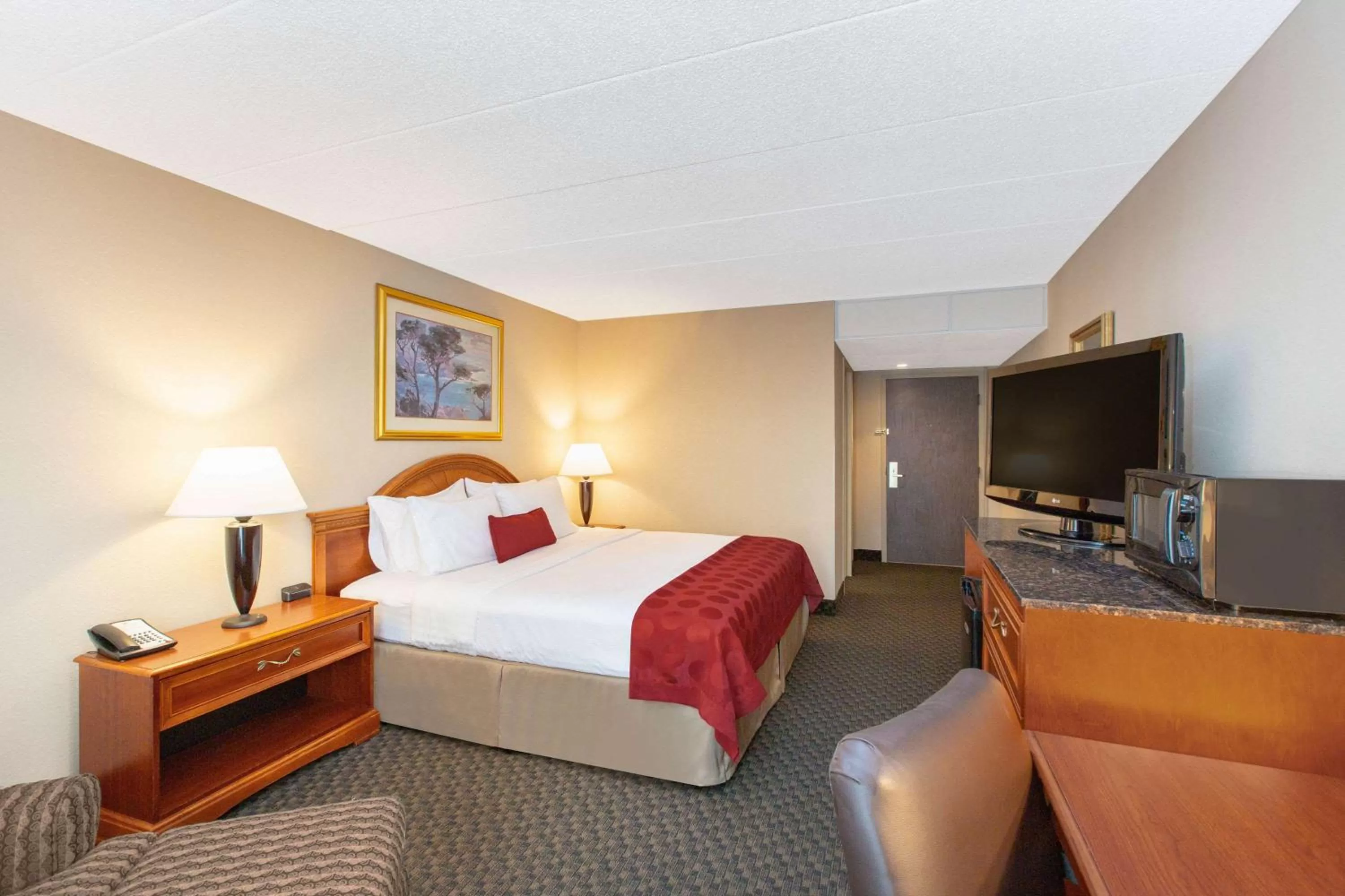 Photo of the whole room, Bed in Ramada by Wyndham Midtown Grand Island