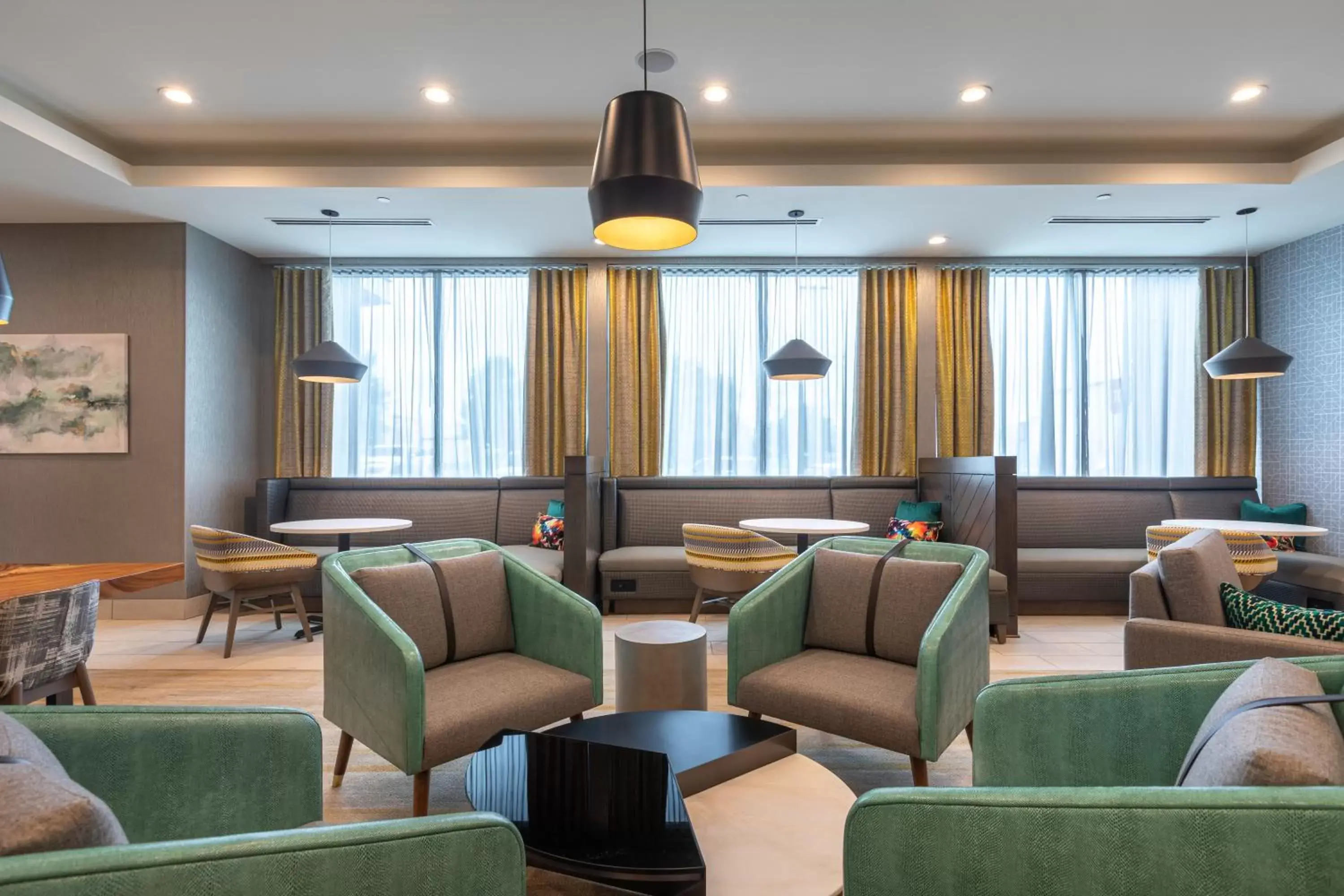 Communal lounge/ TV room, Lounge/Bar in Holiday Inn Greenville - Woodruff Road, an IHG Hotel