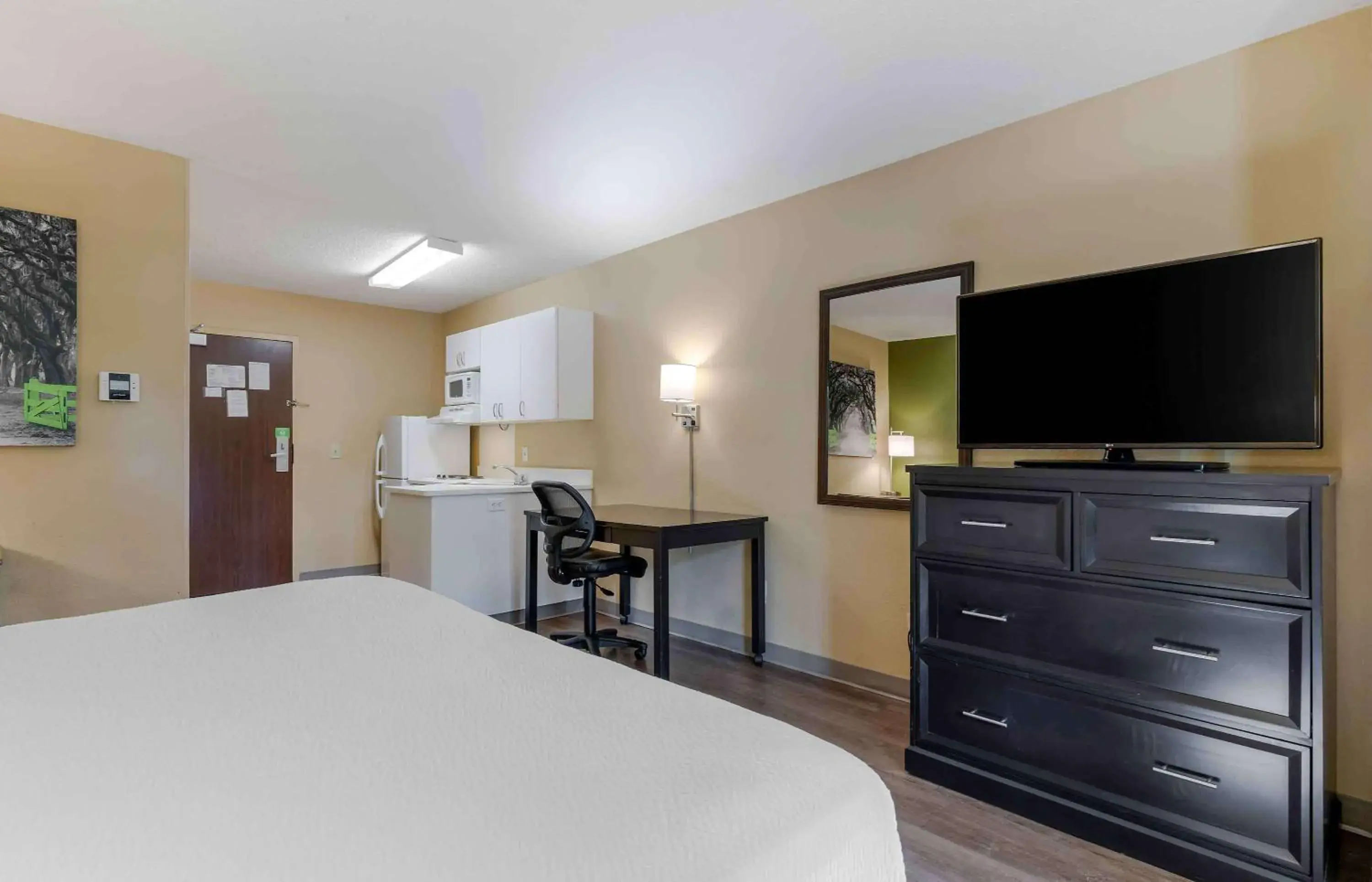 Bedroom, TV/Entertainment Center in Extended Stay America Suites - Greensboro - Wendover Ave - Big Tree Way