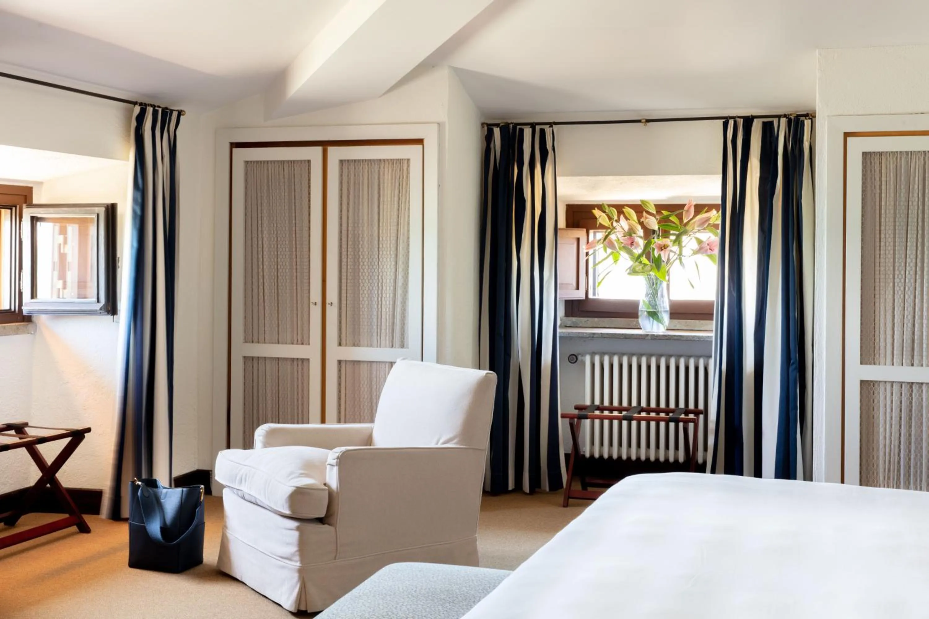 Living room, Bed in La Posta Vecchia Hotel