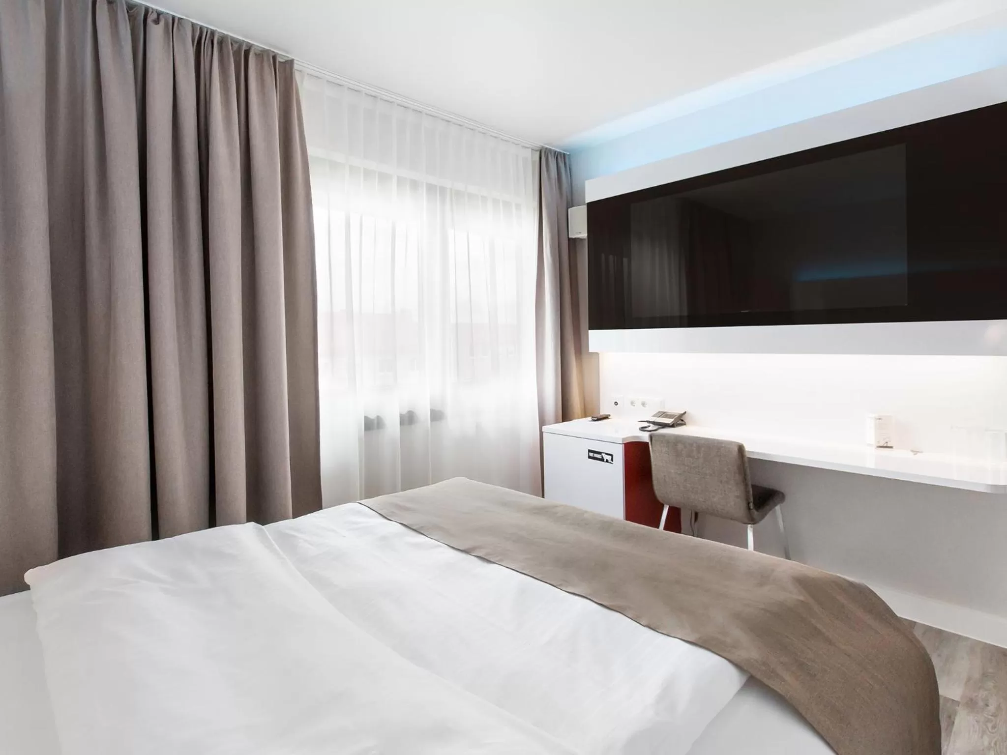 Photo of the whole room, Bed in DORMERO Hotel Hannover