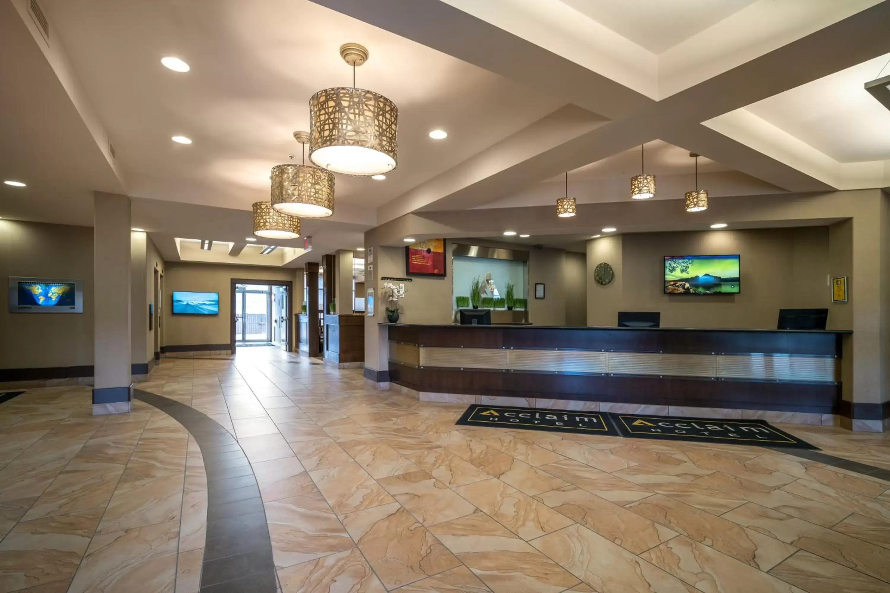 Lobby or reception in Acclaim Hotel by CLIQUE Lobby or reception in Acclaim Hotel by CLIQUE