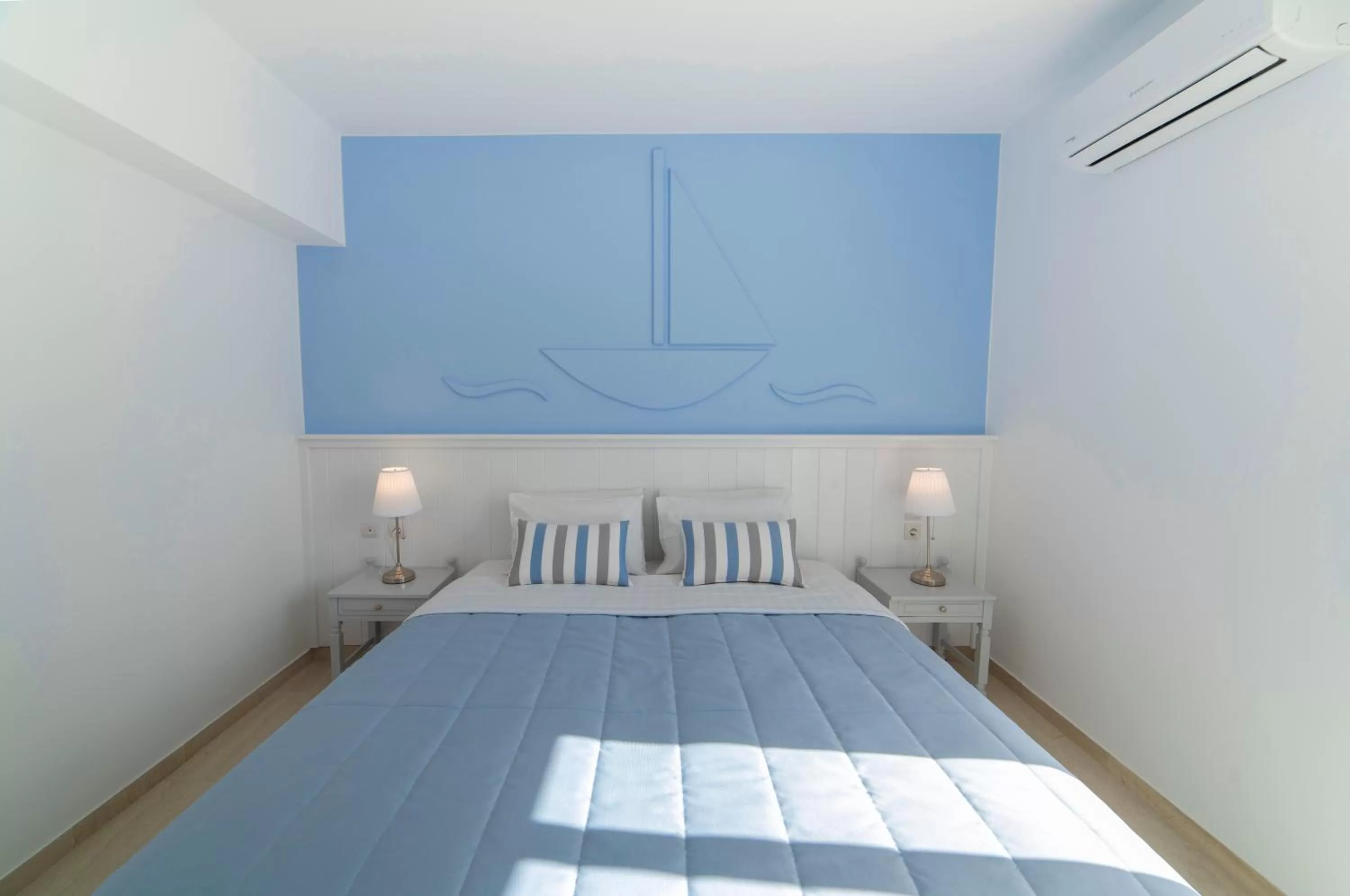 Bed in Naiades Marina Hotel