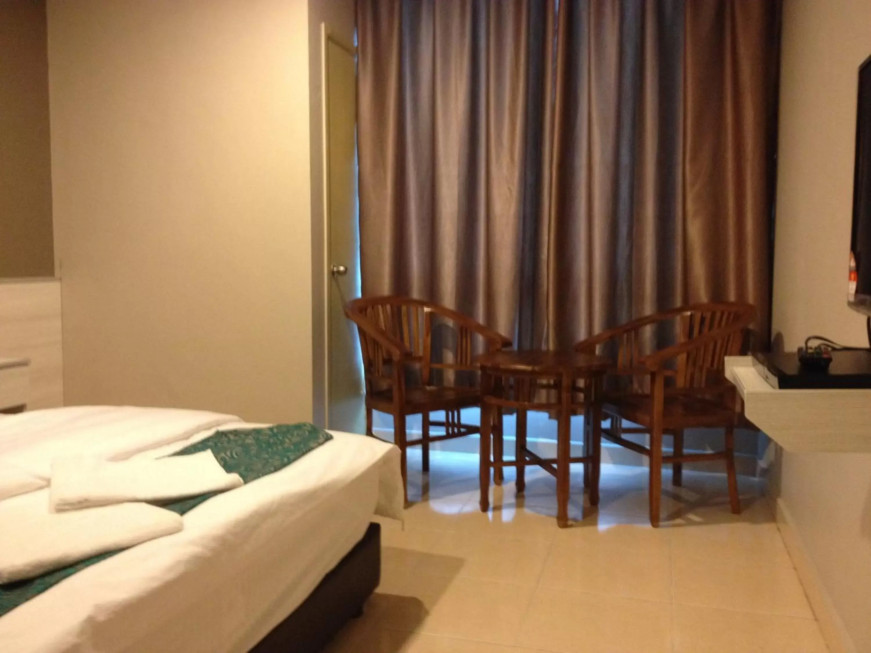 Bed, Seating Area in AERO Star Hotel