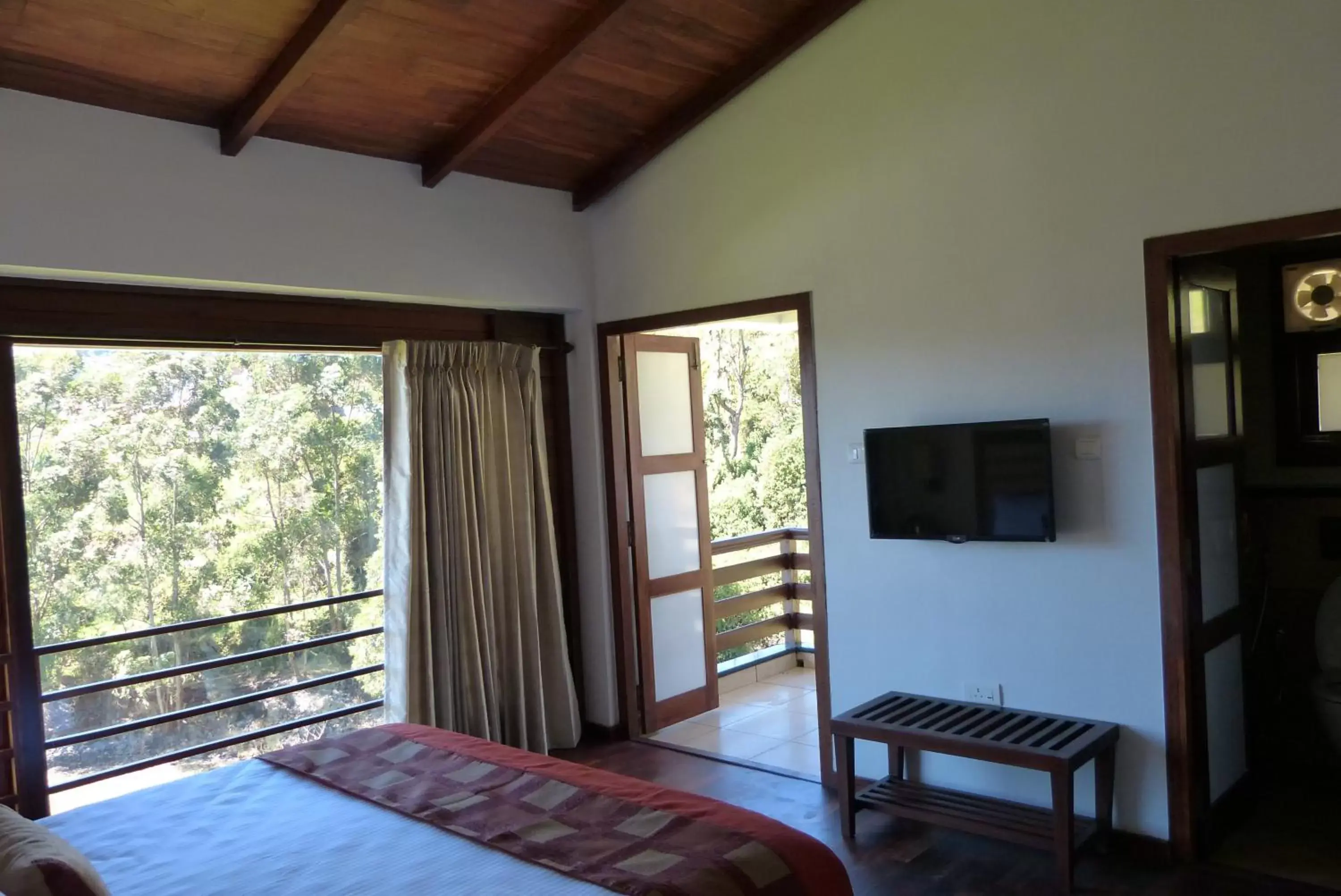 Photo of the whole room, TV/Entertainment Center in GReaT trails Kodaikanal by GRT Hotels