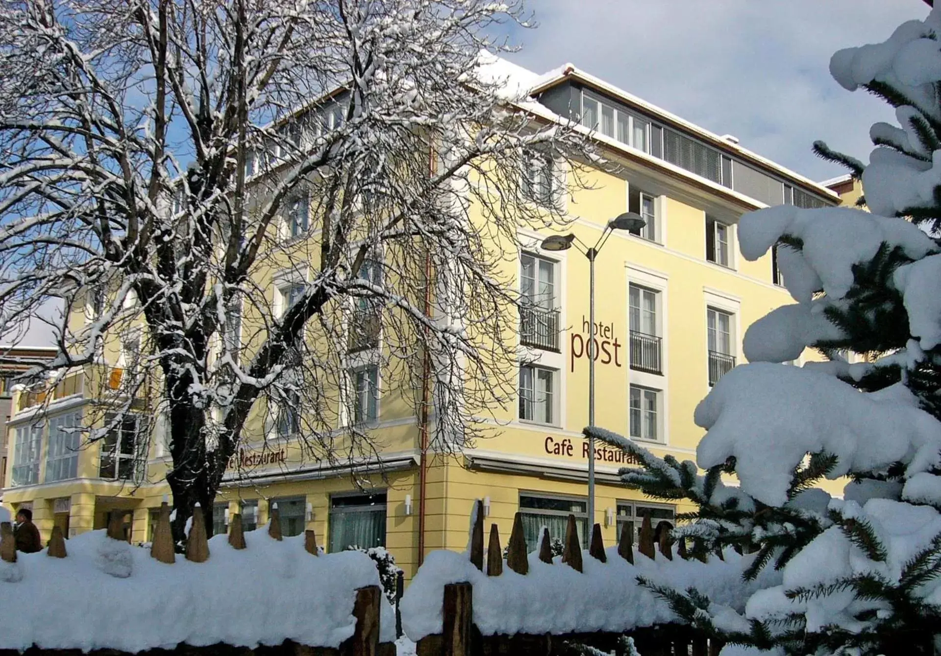 Facade/entrance, Winter in HOTEL POST alpine cityflair