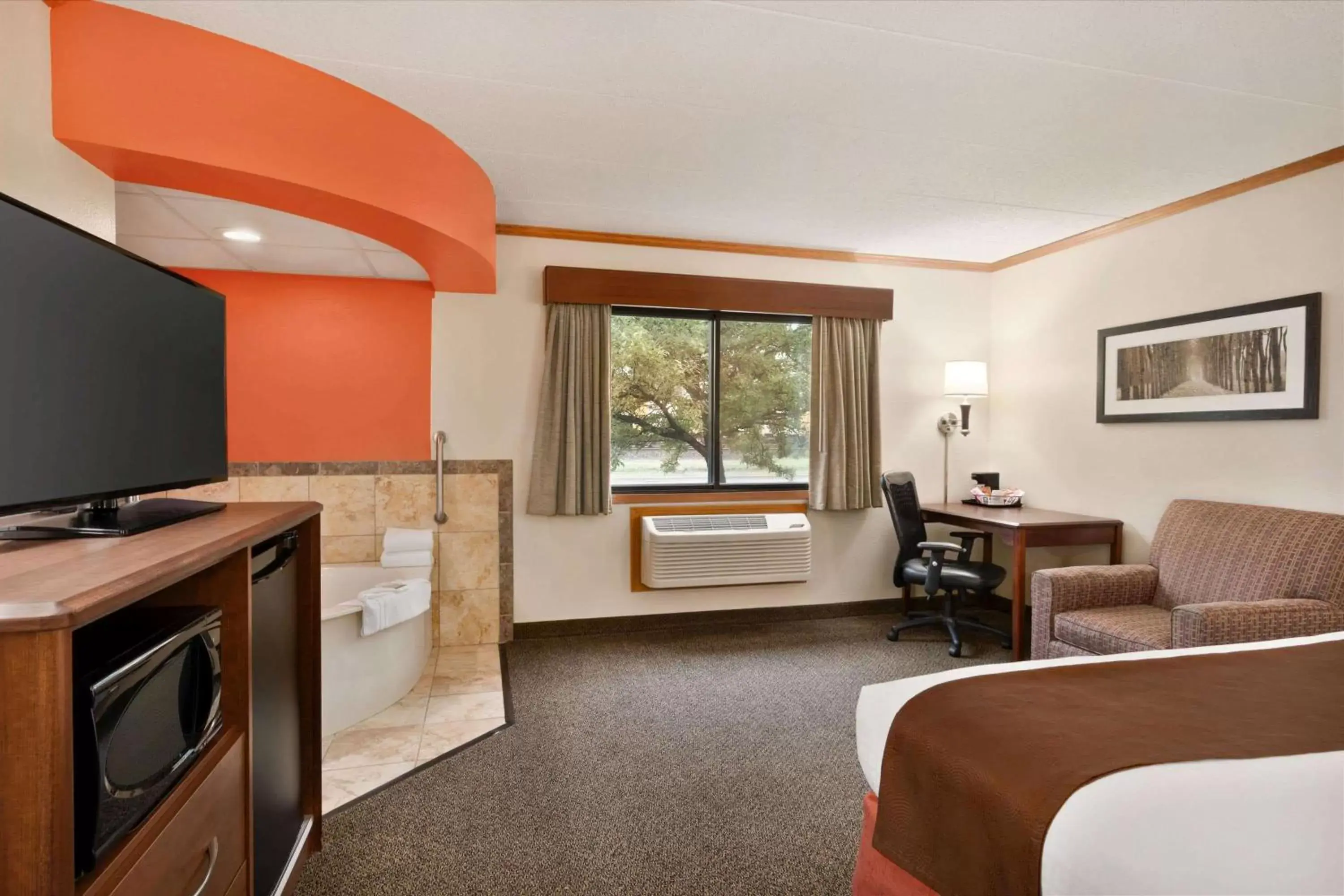 Photo of the whole room, TV/Entertainment Center in AmericInn by Wyndham Virginia