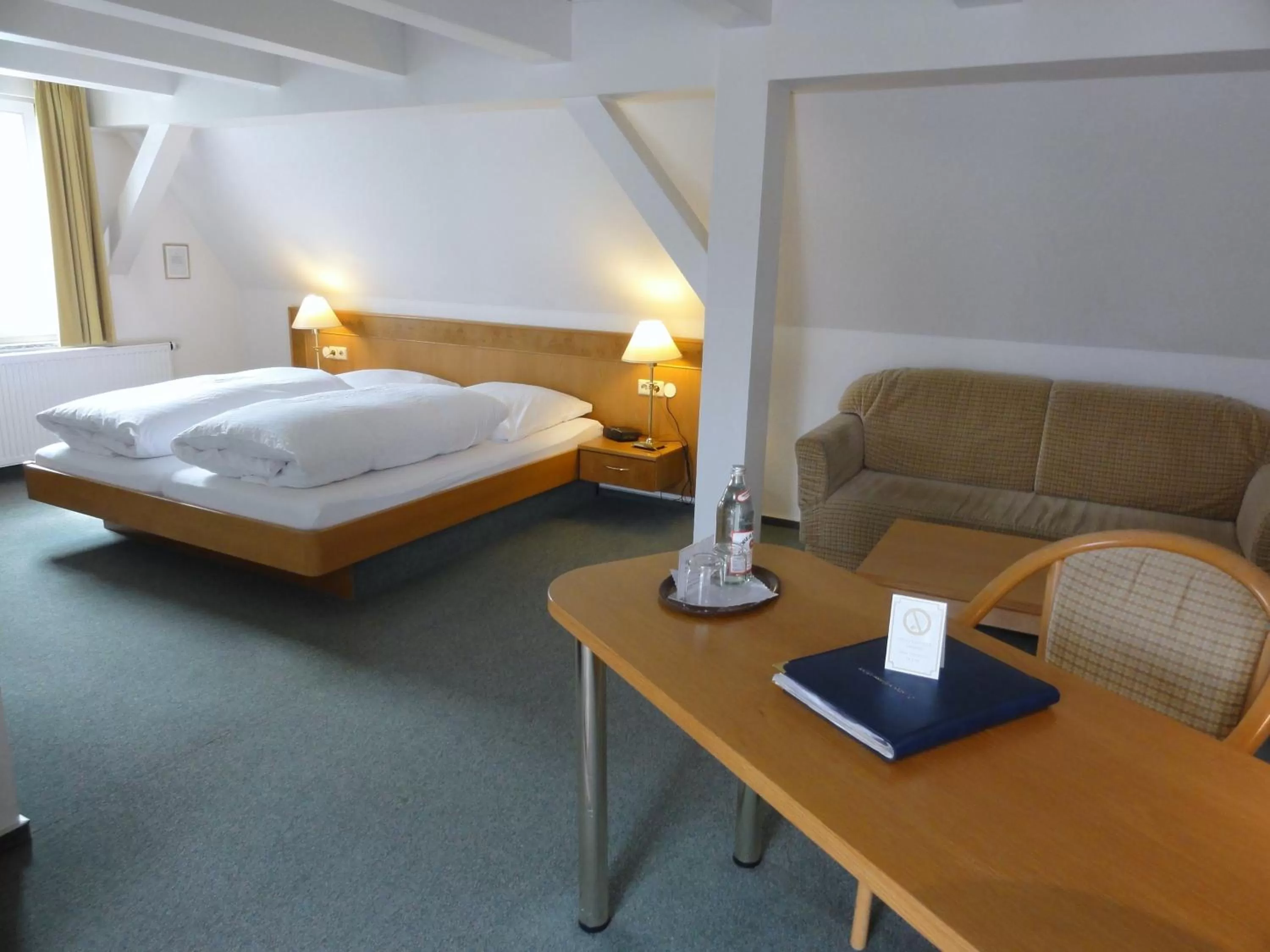 Seating area, Bed in Hotel Württemberger Hof Garni