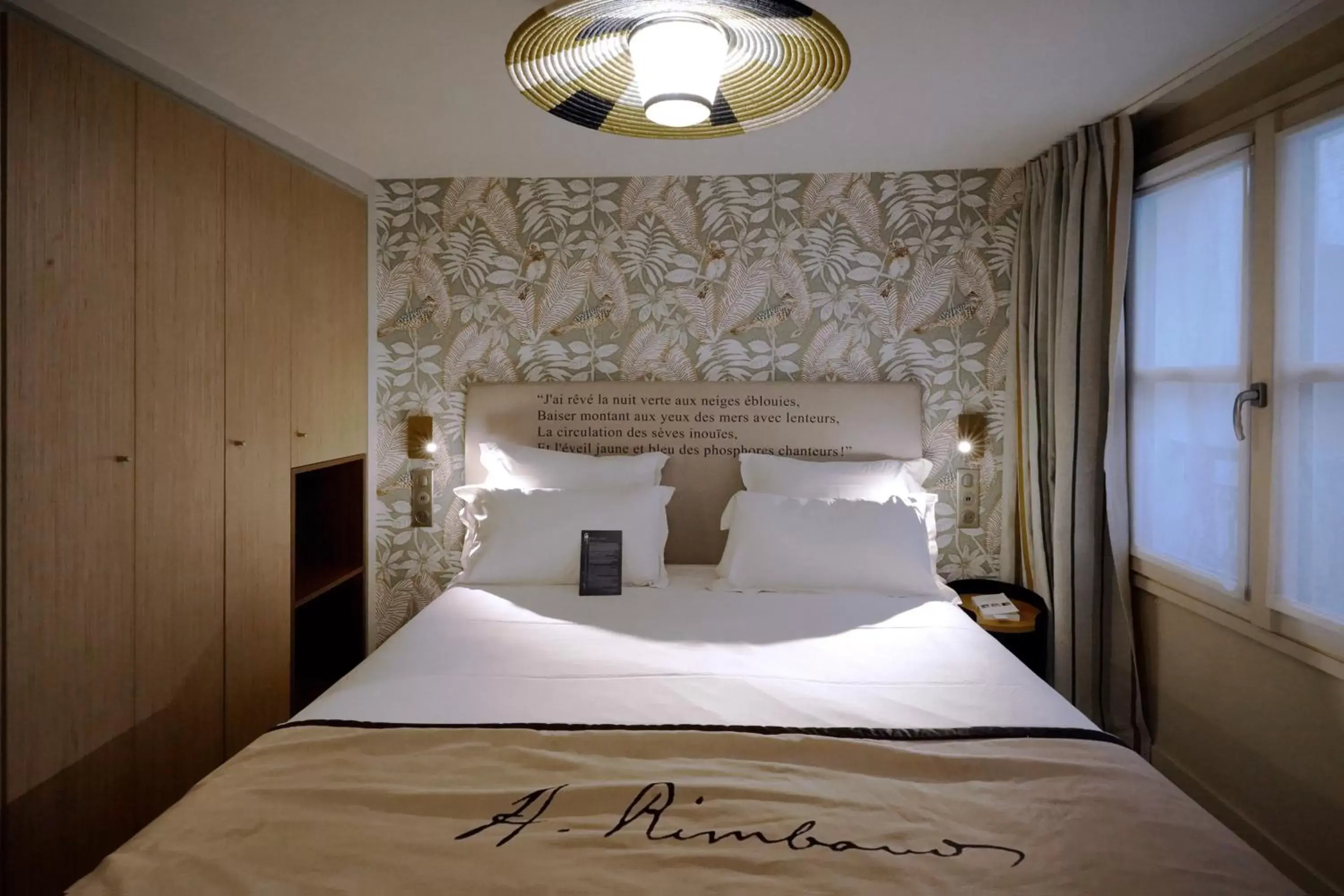 Bed in Hôtel Littéraire Arthur Rimbaud, BW Signature Collection
