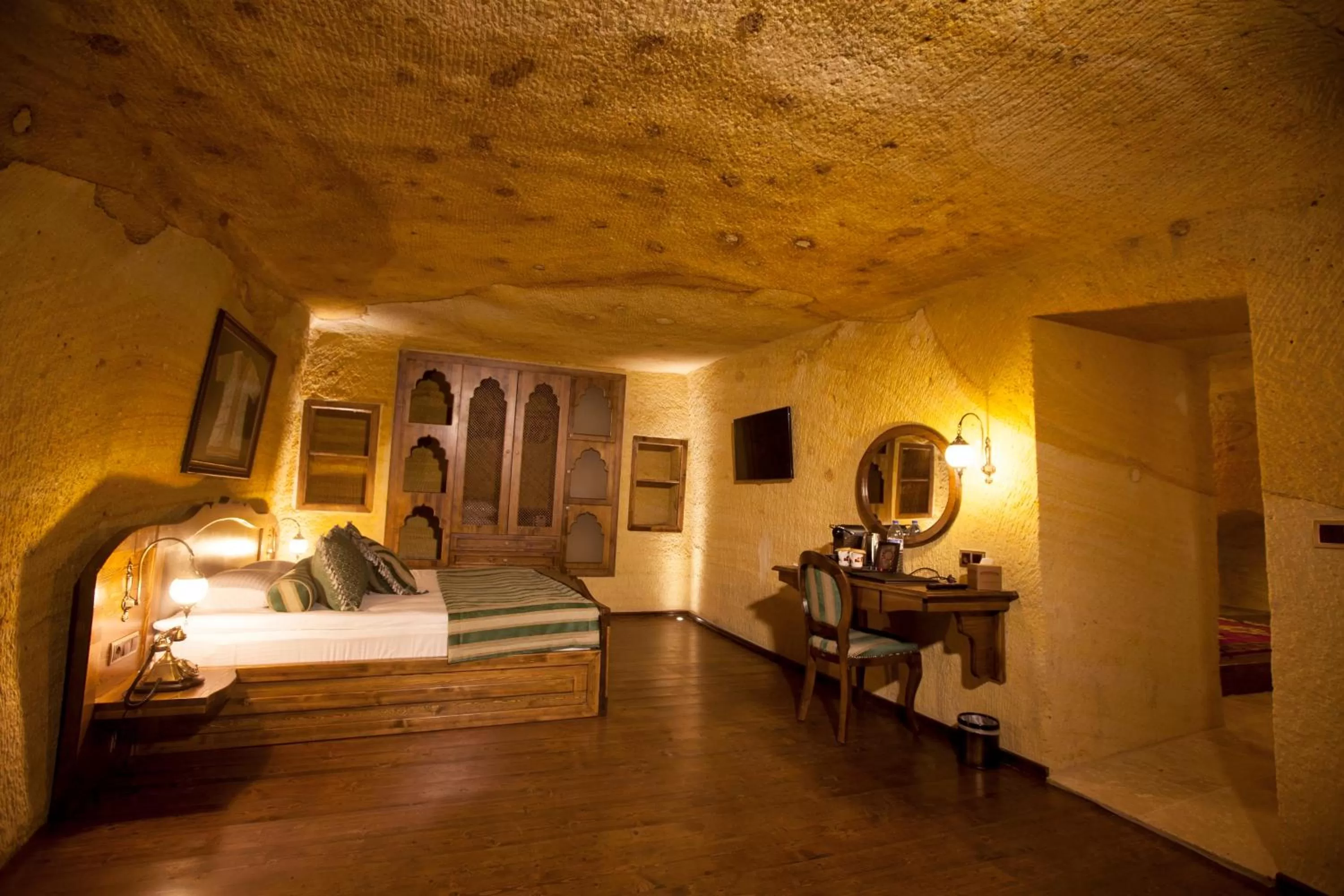 Bed in Kayakapi Premium Caves Cappadocia