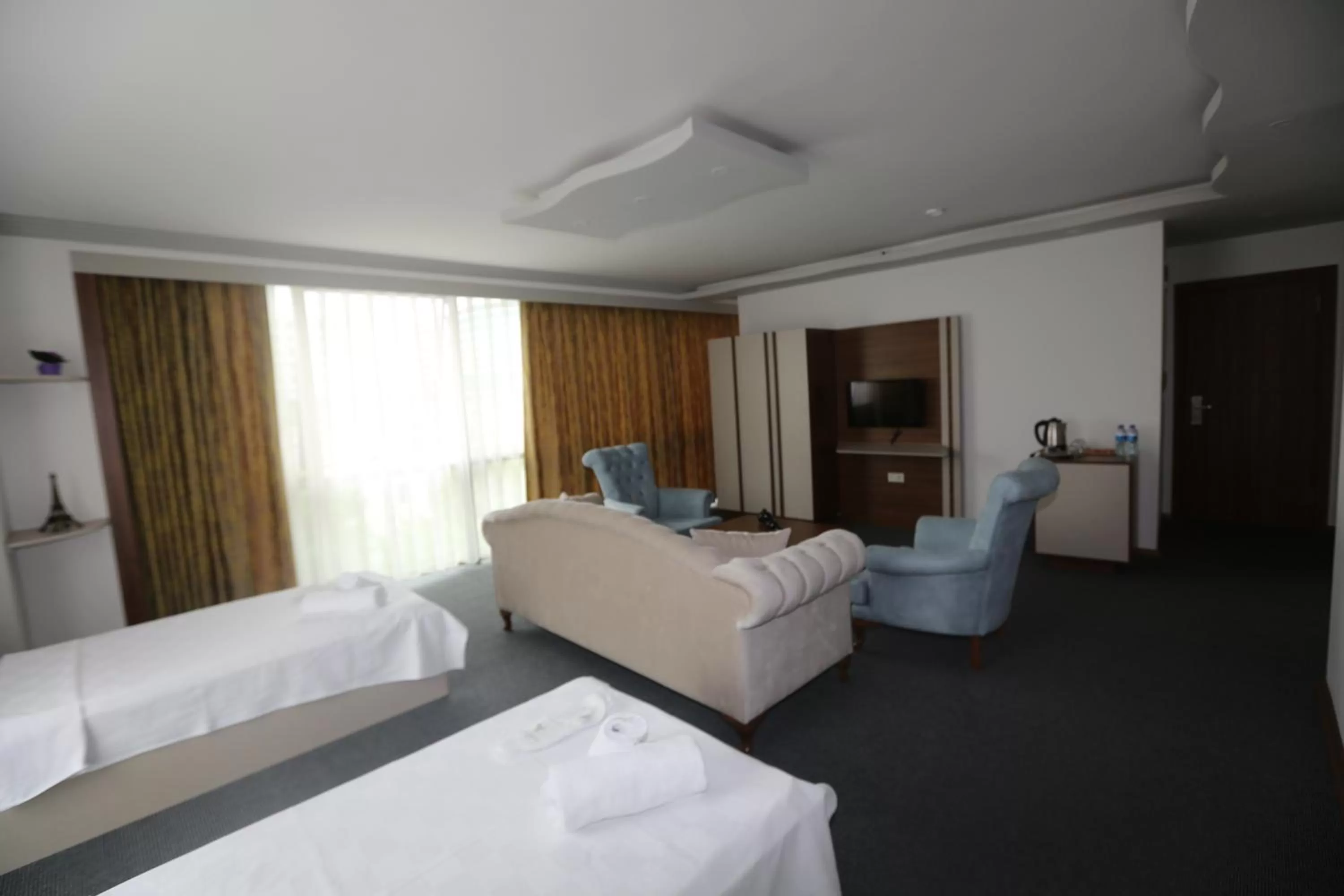 Bed in TEVETOGLU HOTEL