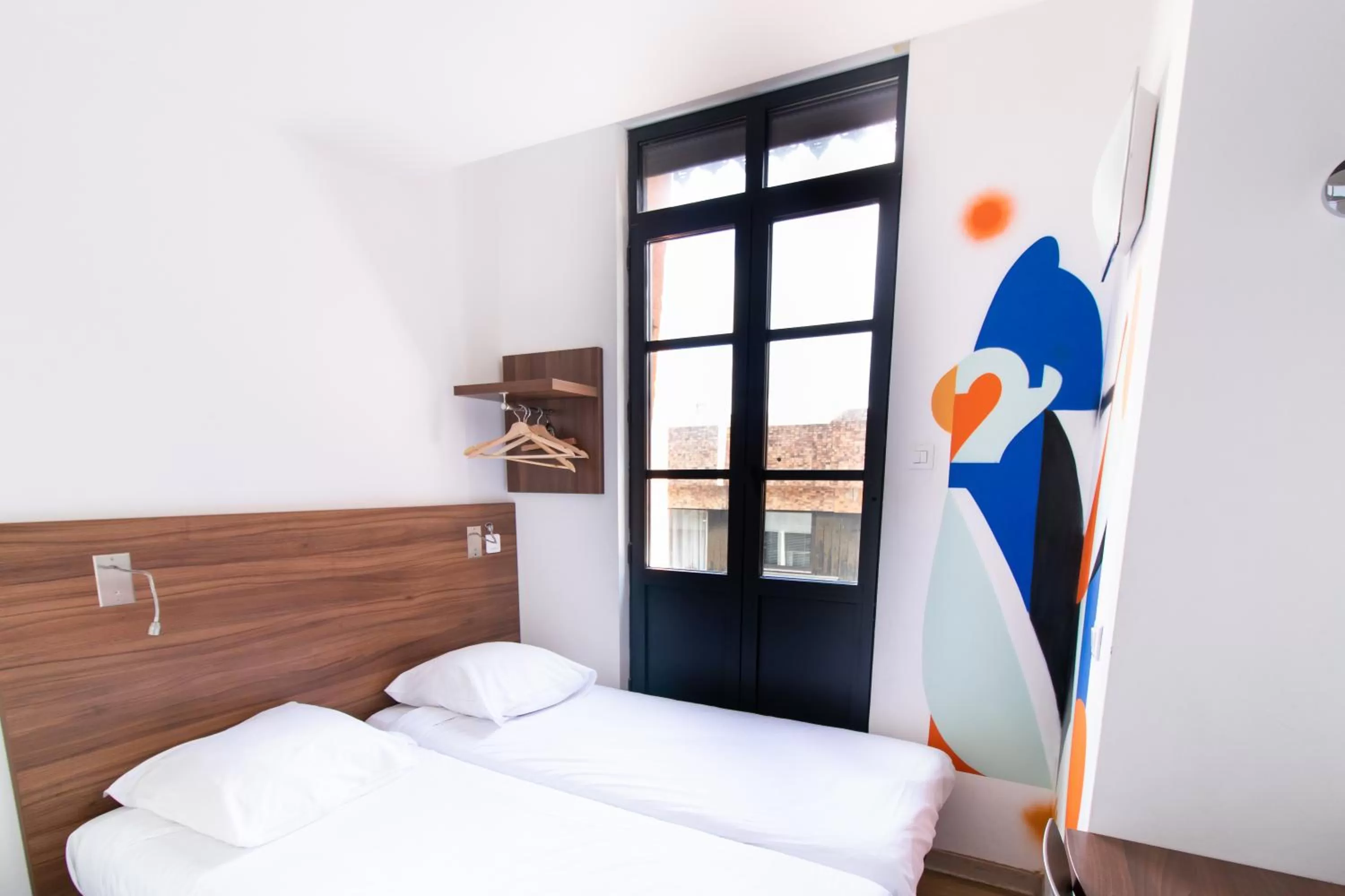 Photo of the whole room, Bed in Hôtel le Pastel