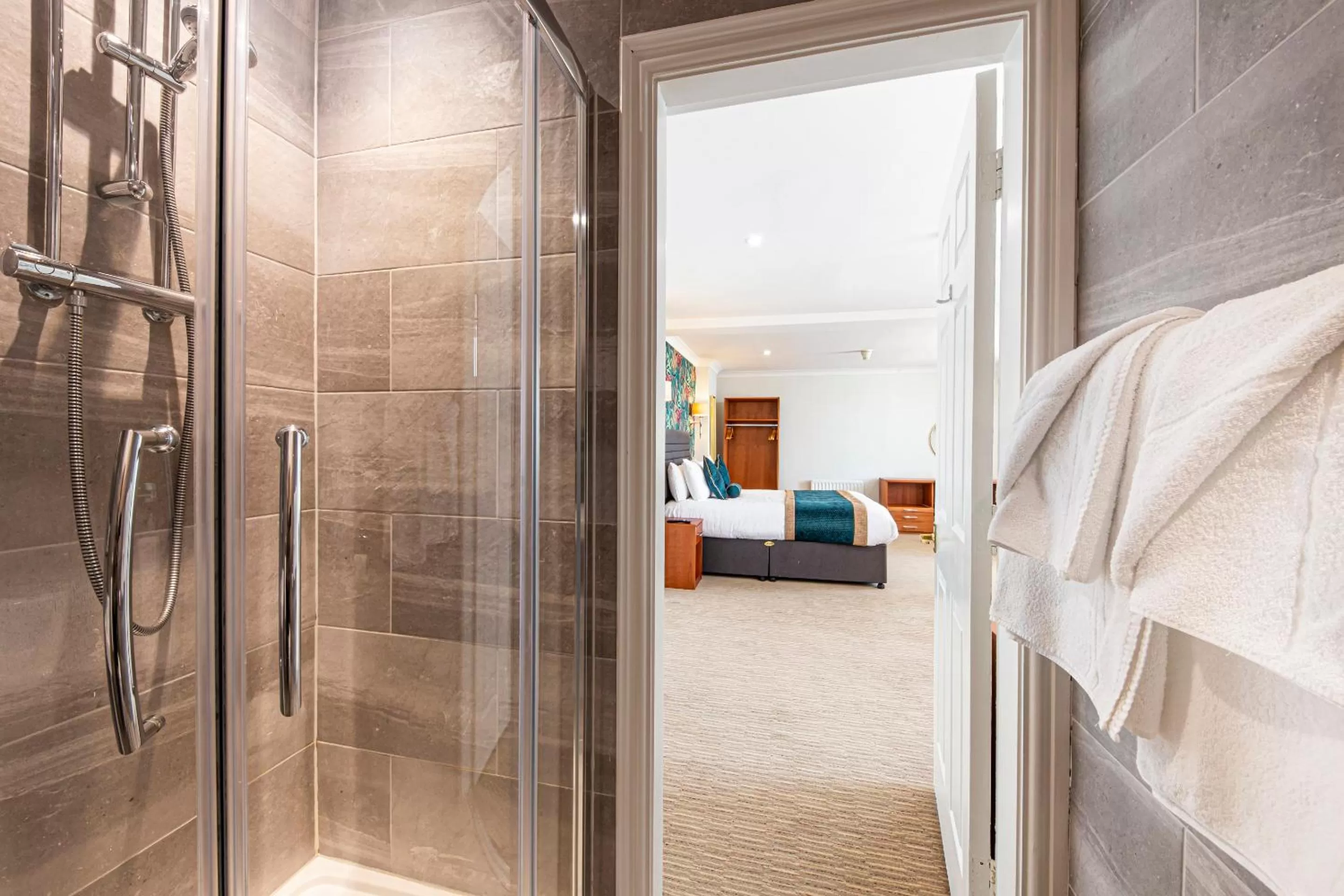 Bathroom, Bed in The Beaches Hotel and Spa