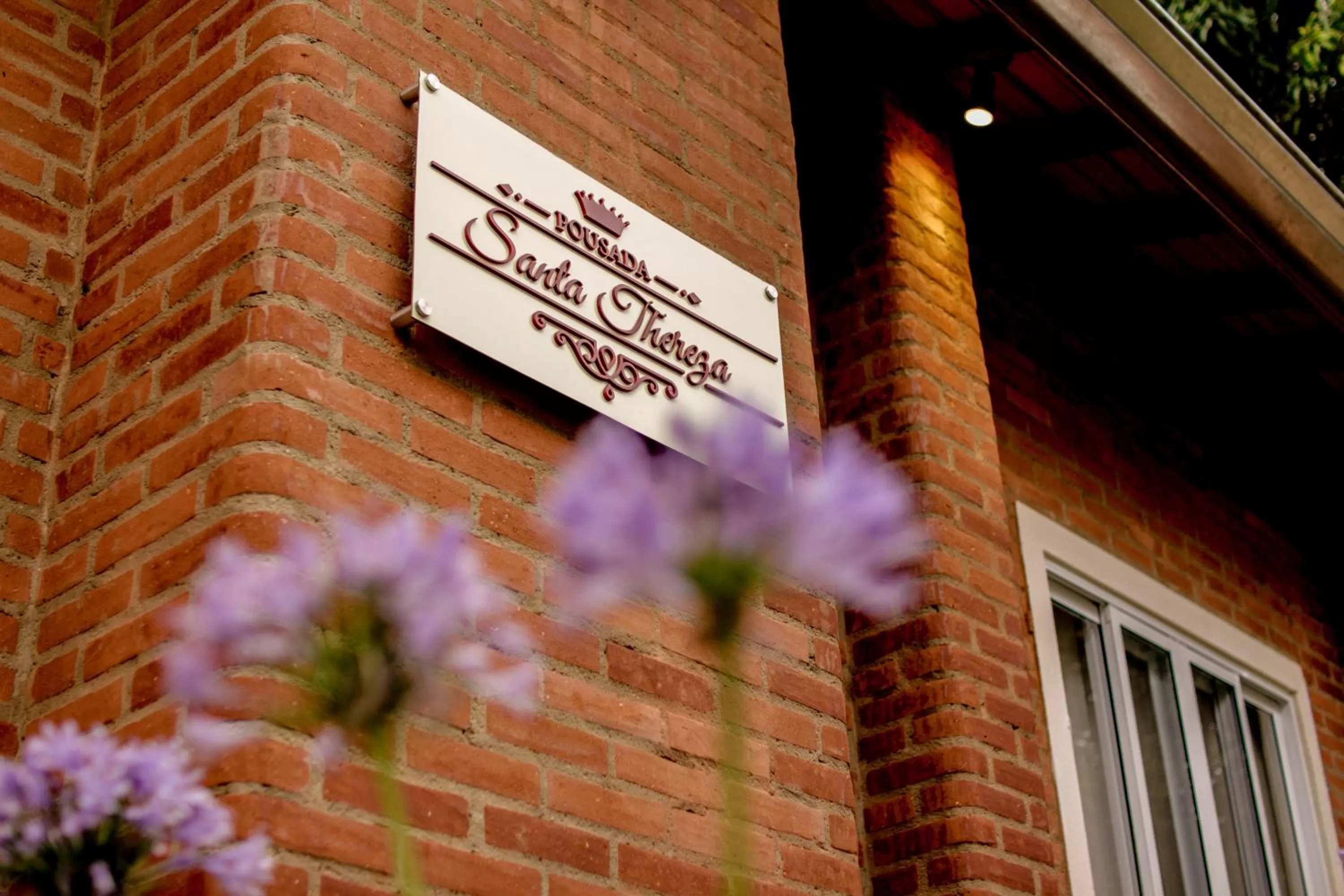 Property logo or sign in Pousada Santa Thereza