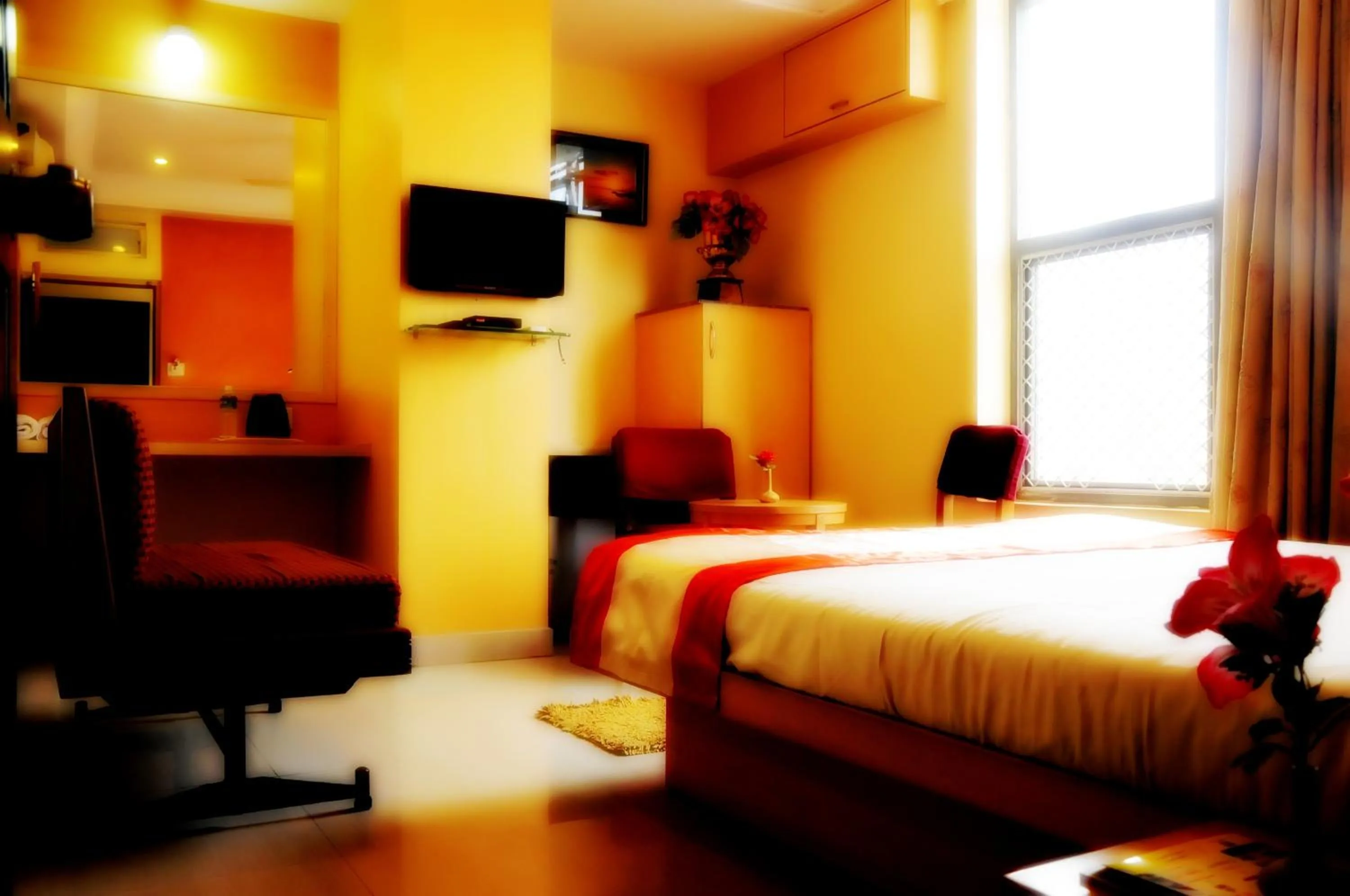 Photo of the whole room, Bed in Suvarna Residency