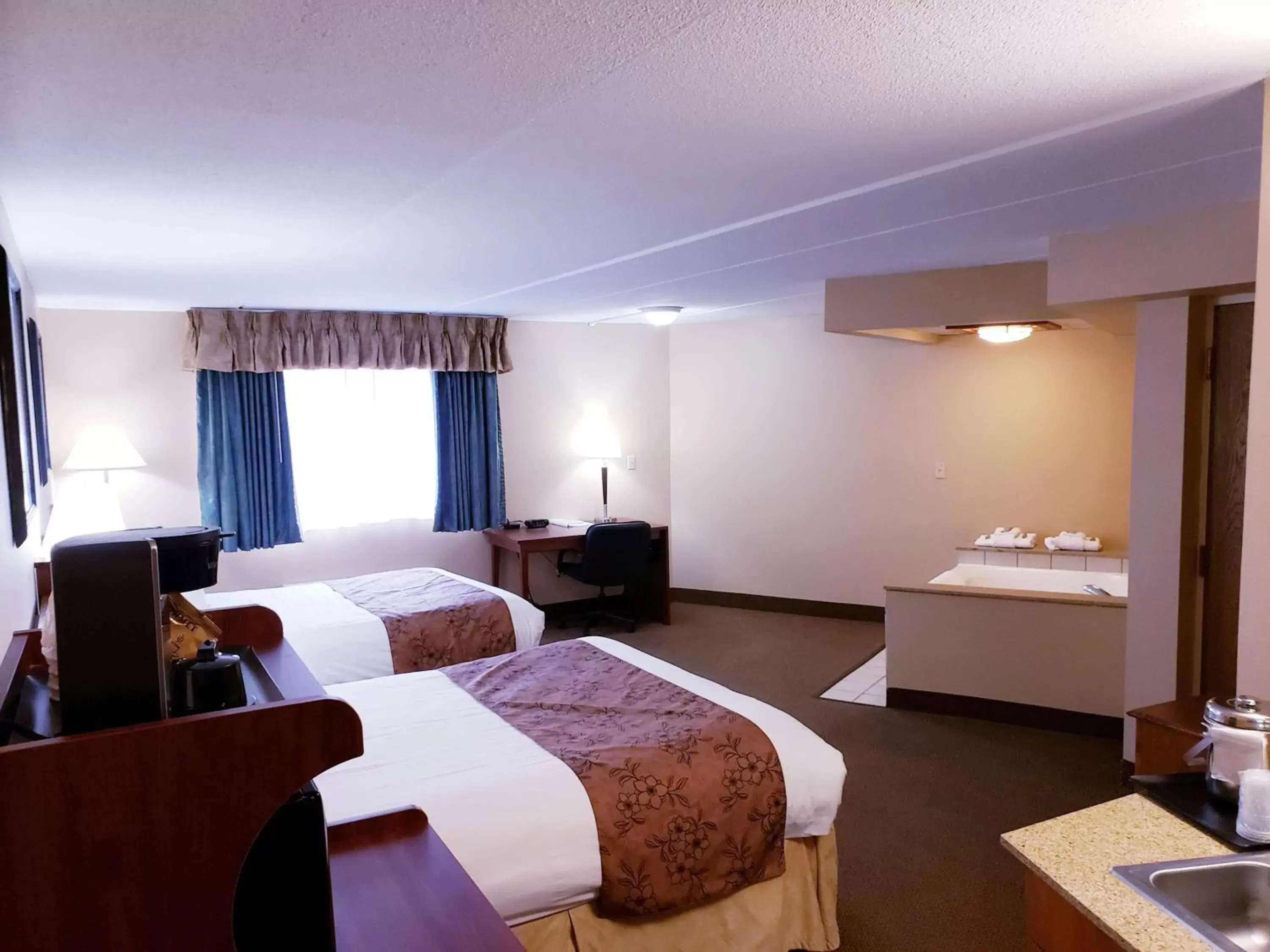 Photo of the whole room in SureStay Plus Hotel by Best Western Black River Falls