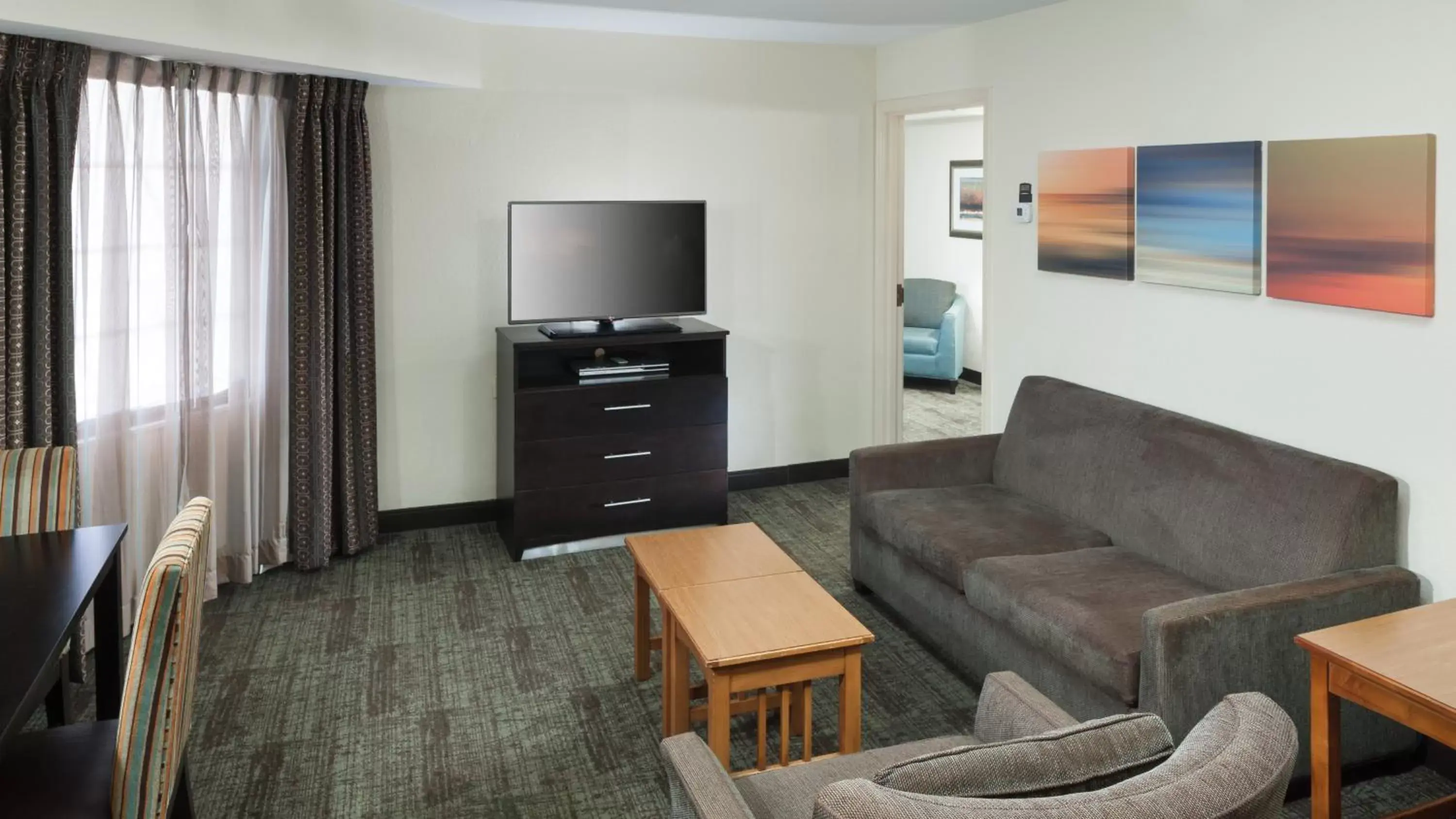 TV and multimedia, Seating Area in Staybridge Suites Jackson, an IHG Hotel