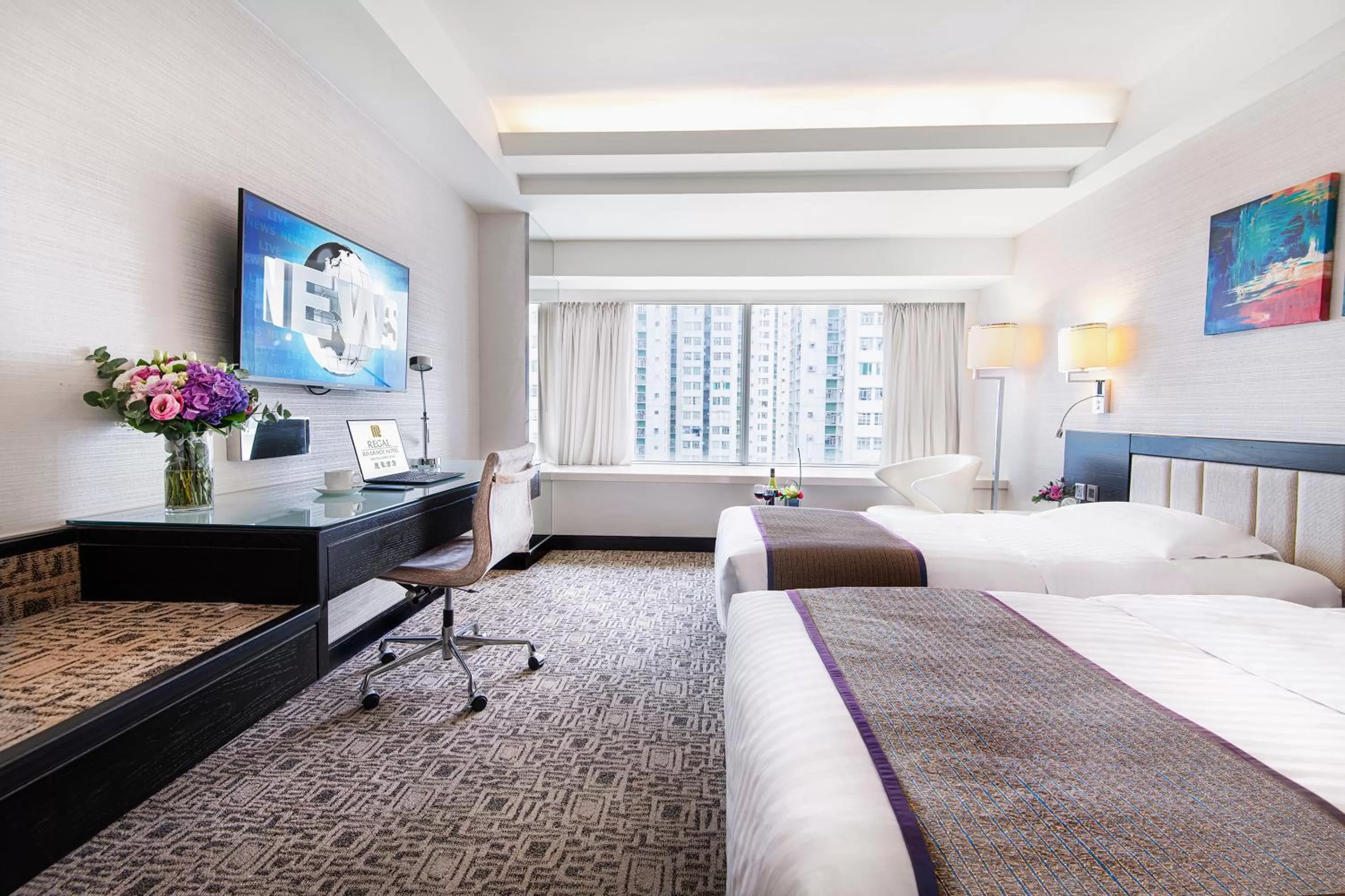 Bed in Regal Riverside Hotel