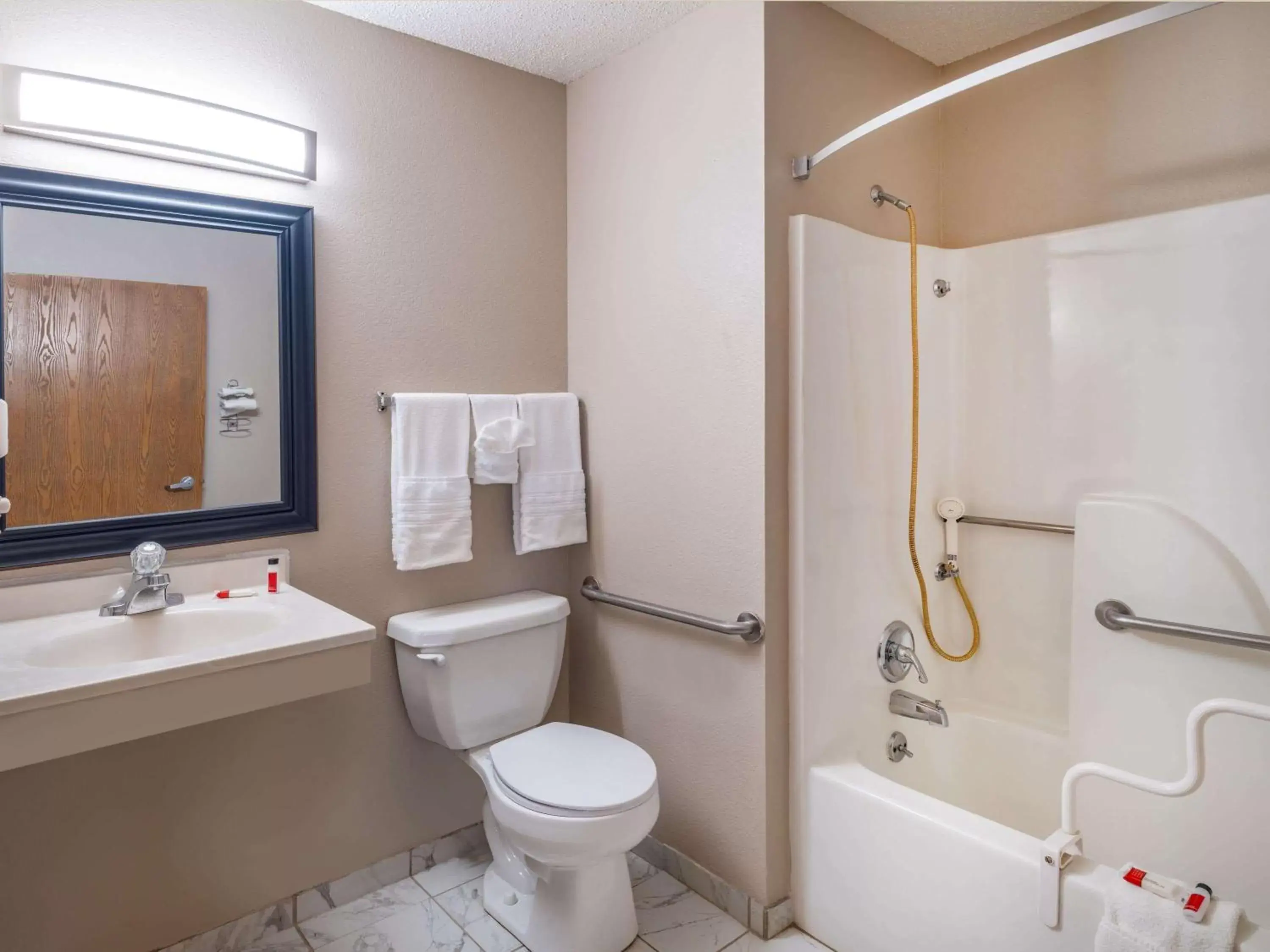 Bathroom in Super 8 by Wyndham Clinton