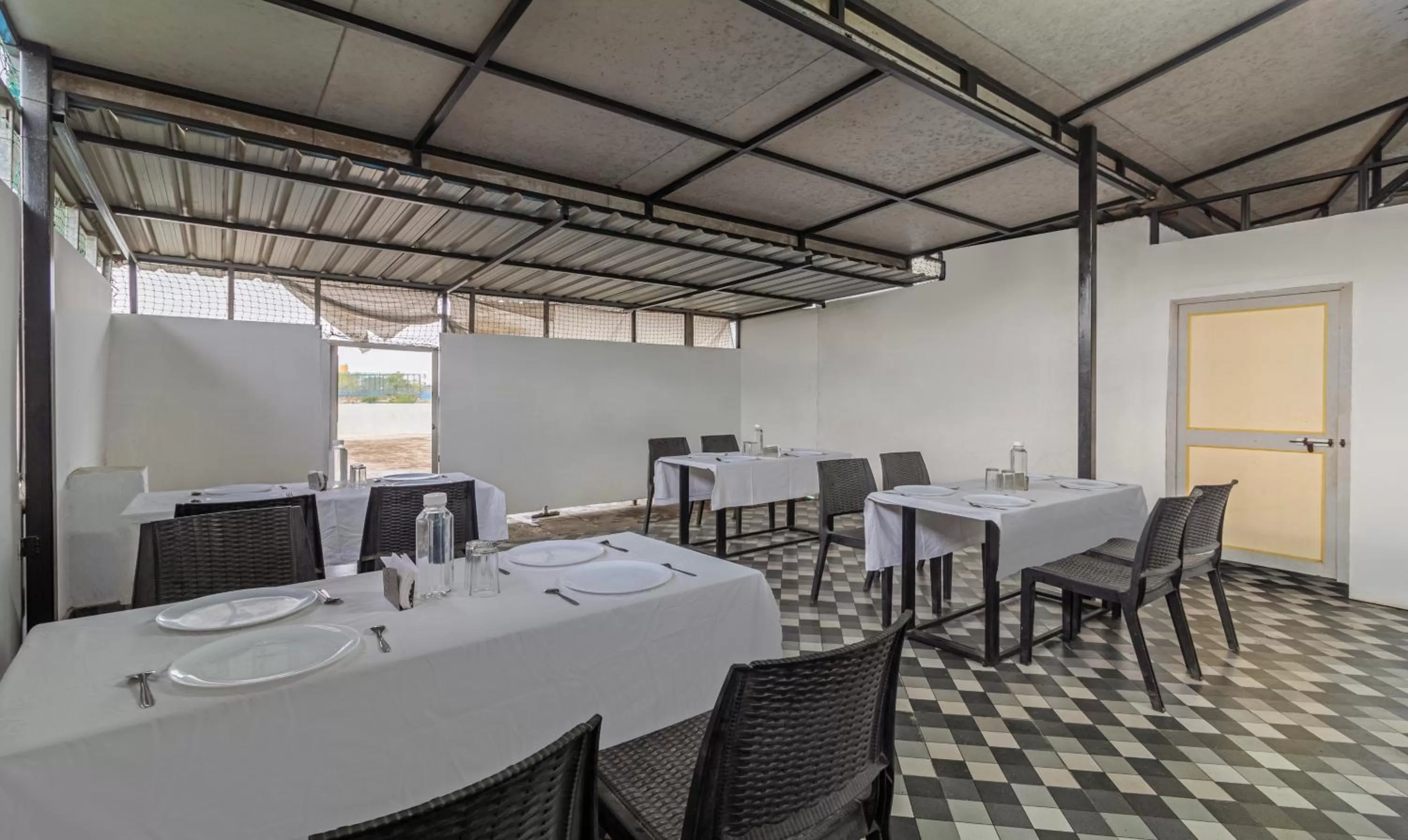 Dining area in Treebo Tulip Comfort
