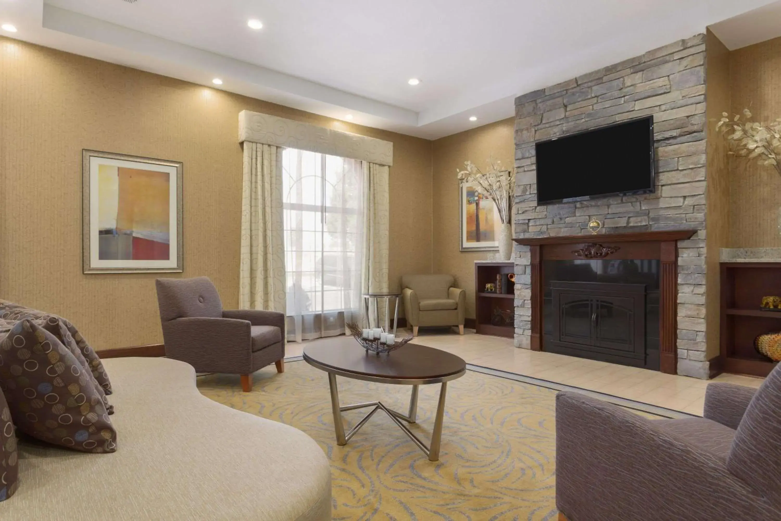 Lobby or reception, Seating Area in Wyndham Garden Grand Rapids Airport