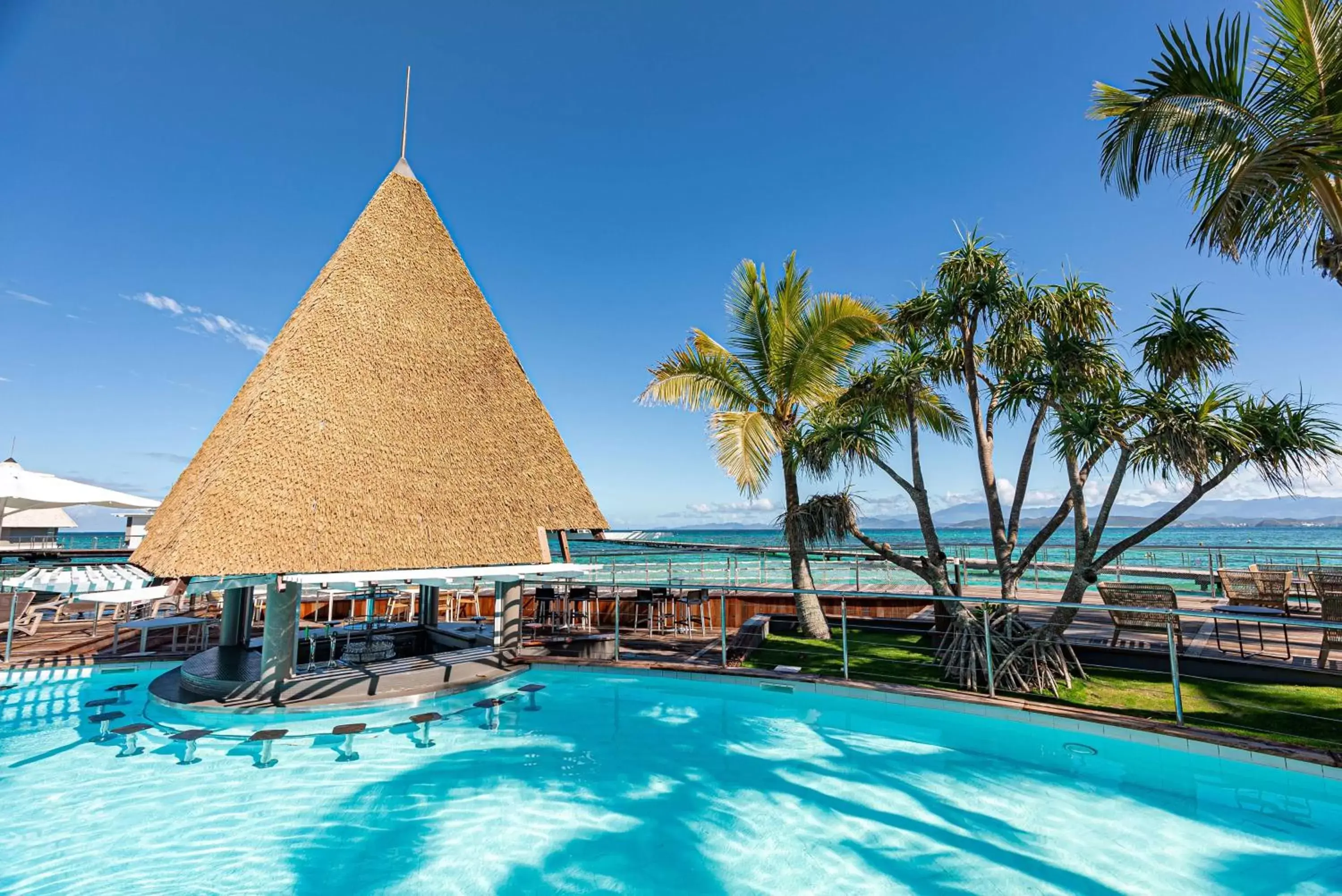 Lounge or bar, Swimming Pool in DoubleTree by Hilton Noumea Ilot Maitre Resort