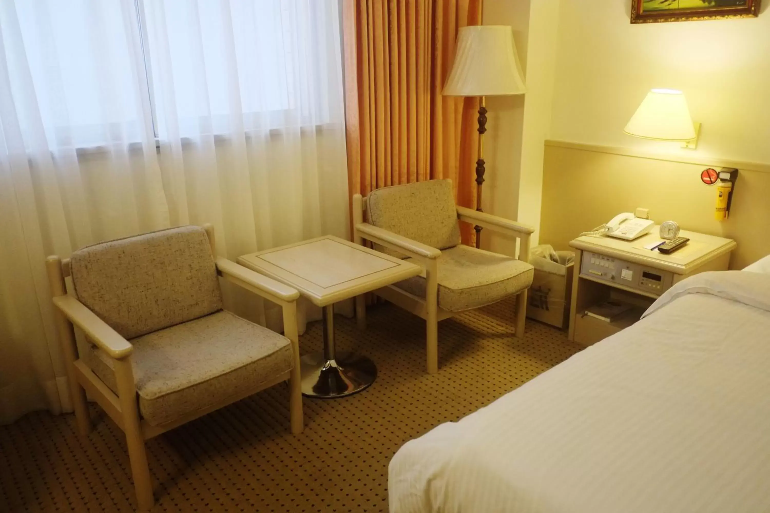 Bed, Seating Area in Emperor Hotel