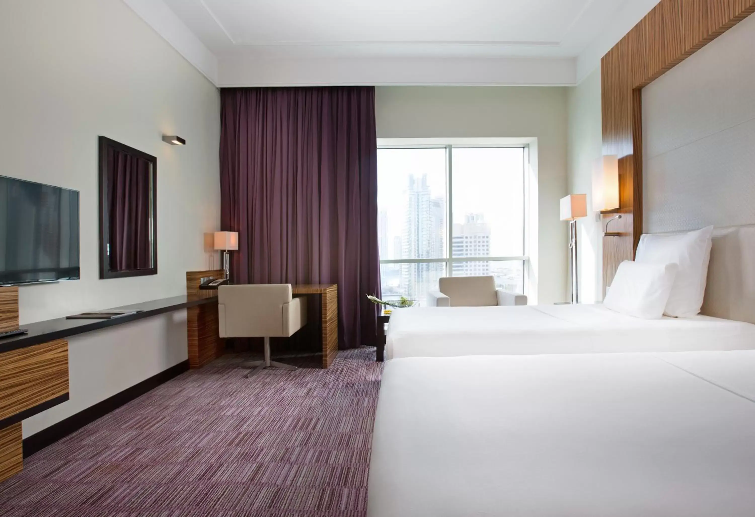 Photo of the whole room, Bed in Pullman Dubai Jumeirah Lakes Towers