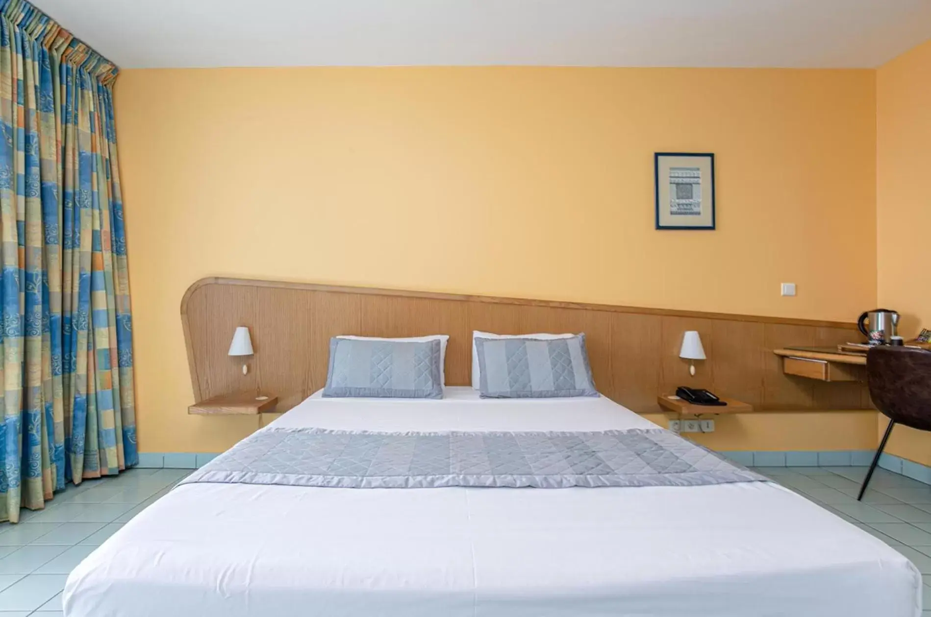 Photo of the whole room, Bed in Zenitude Hôtel Résidences Le Salako Photo of the whole room, Bed in Zenitude Hôtel Résidences Le Salako