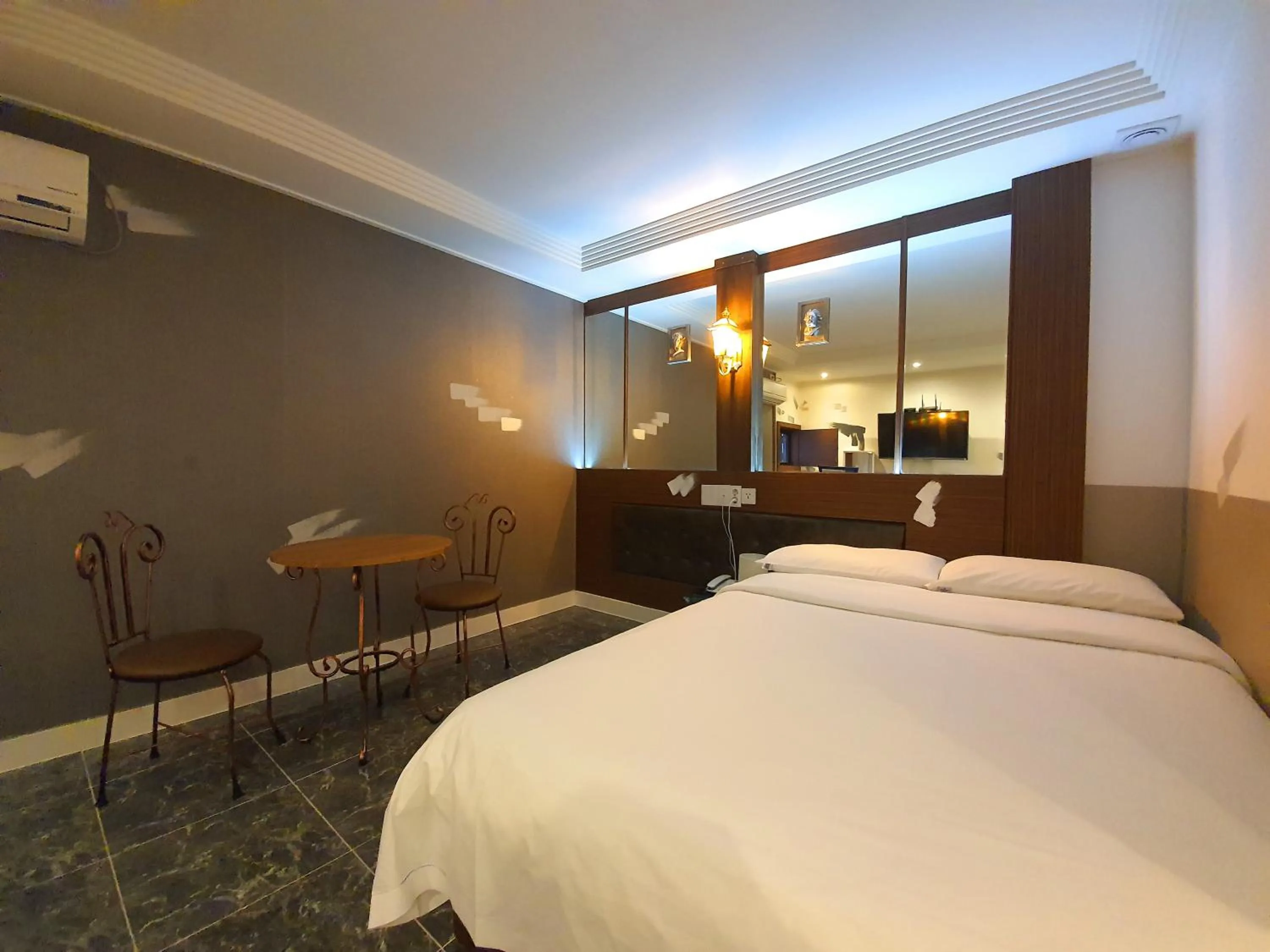 Bed in Friendly DH Naissance Hotel by Mindrum Group