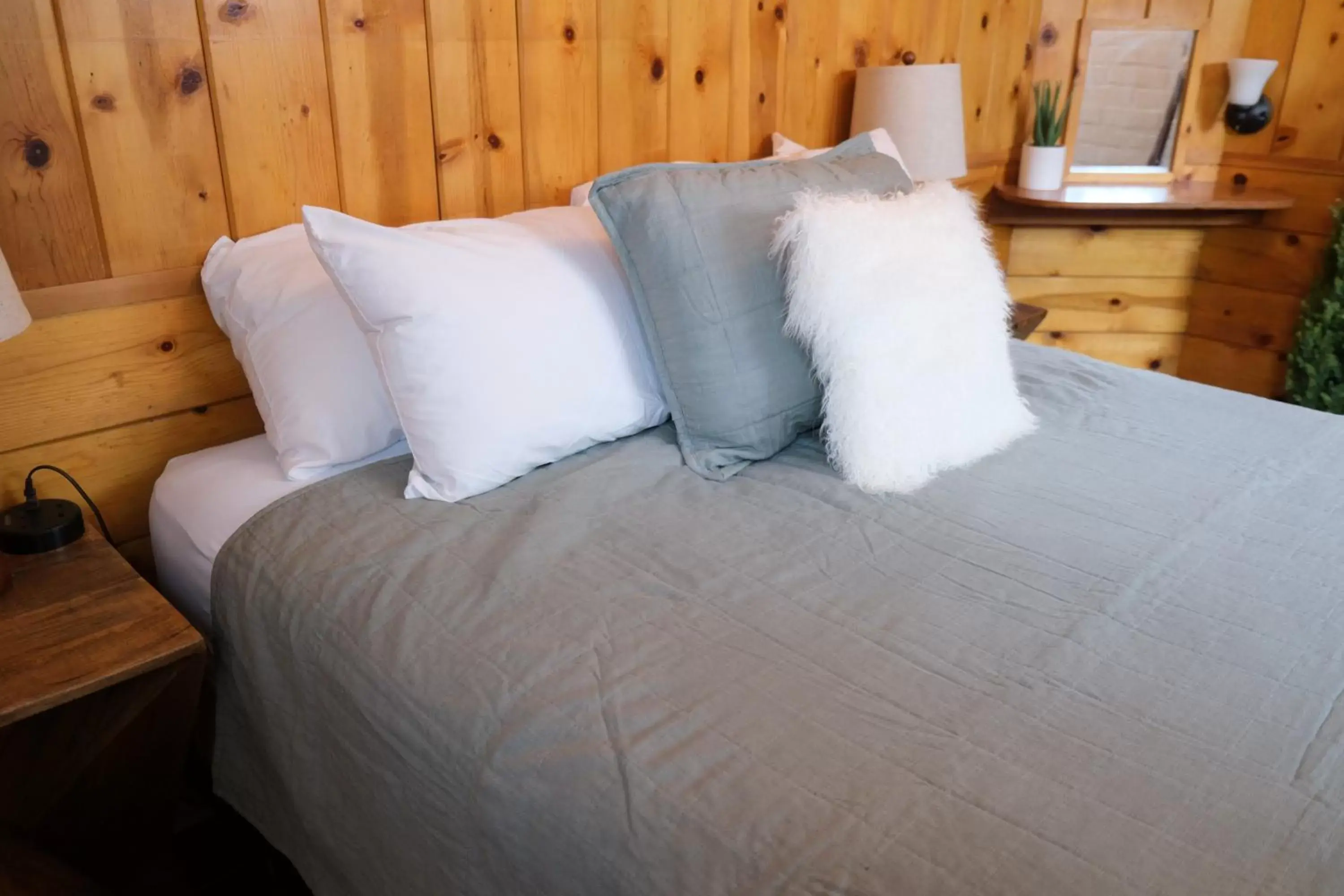 Bed in Lake Front Cabins