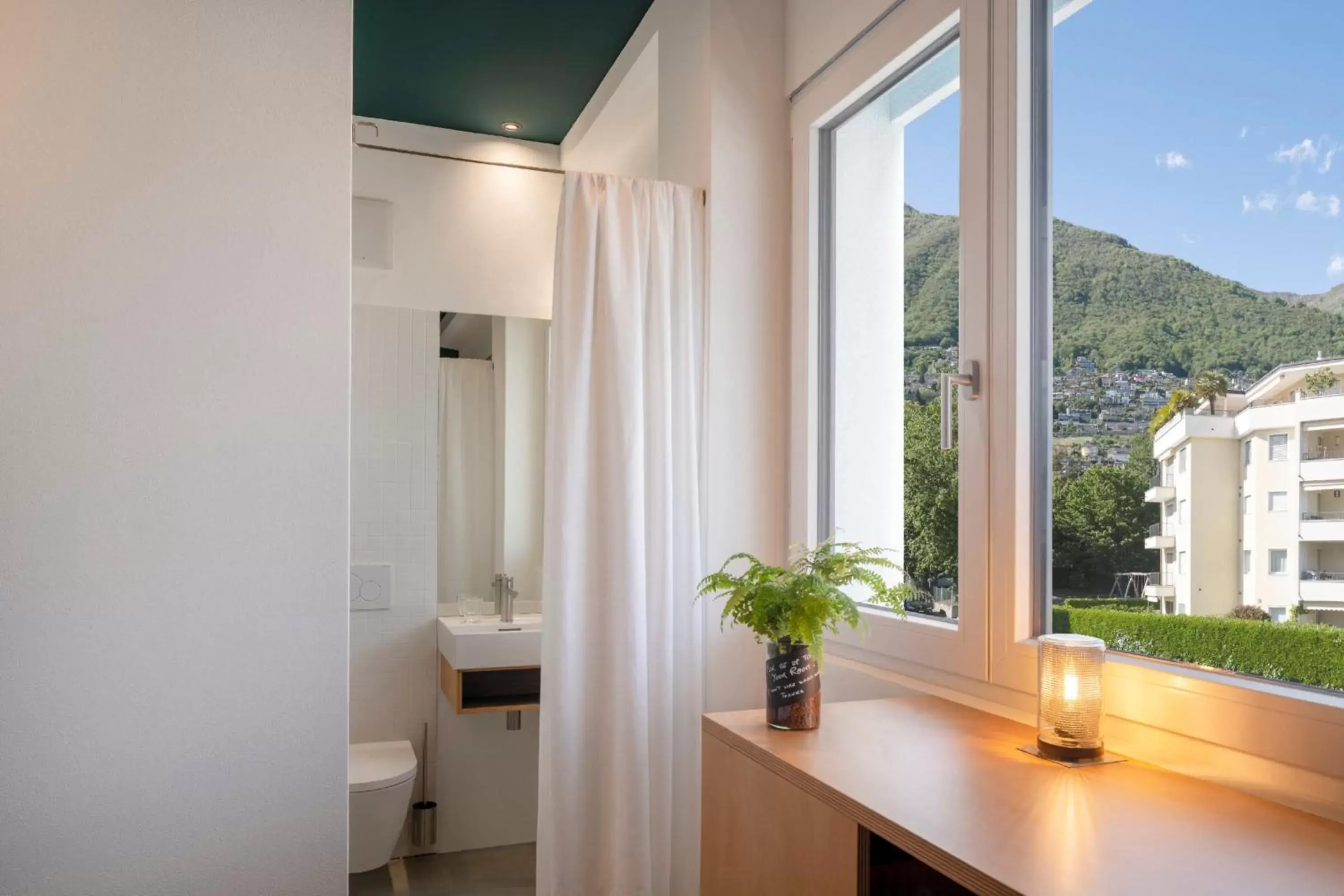 Bathroom, TV/Entertainment Center in Riva Rooms & Studios - Check-In 24hr