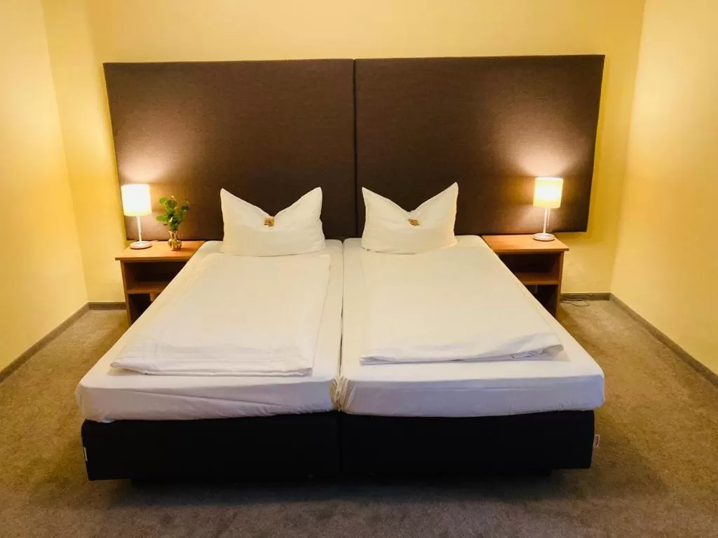 Bed in Hotel Rosenheimer Hof