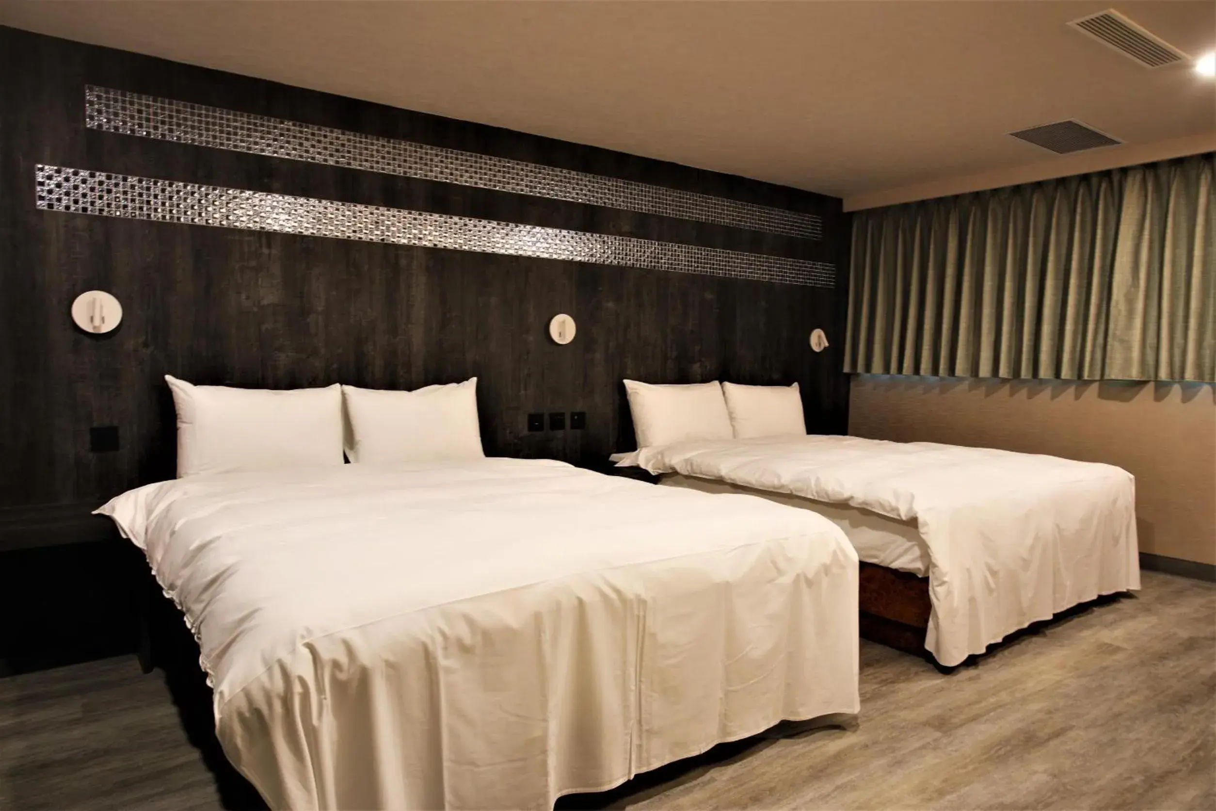 Bed in Goldenhome Hotel