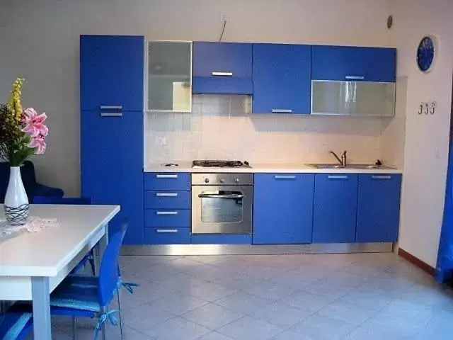 Kitchen/Kitchenette in Villaggio dei Fiori Apart- Hotel 3 Stars - Family Resort