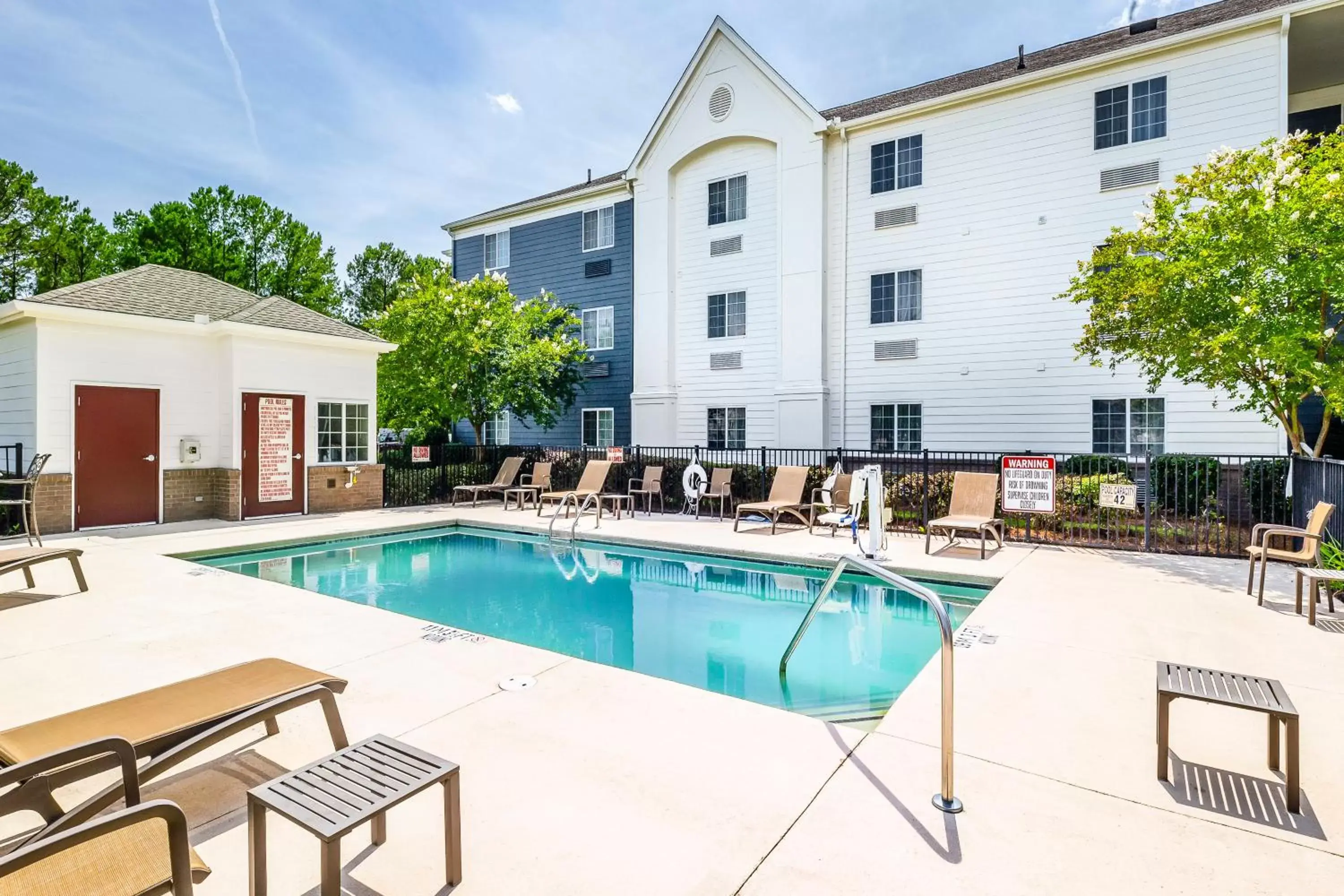Swimming pool, Property Building in Candlewood Suites Savannah Airport, an IHG Hotel