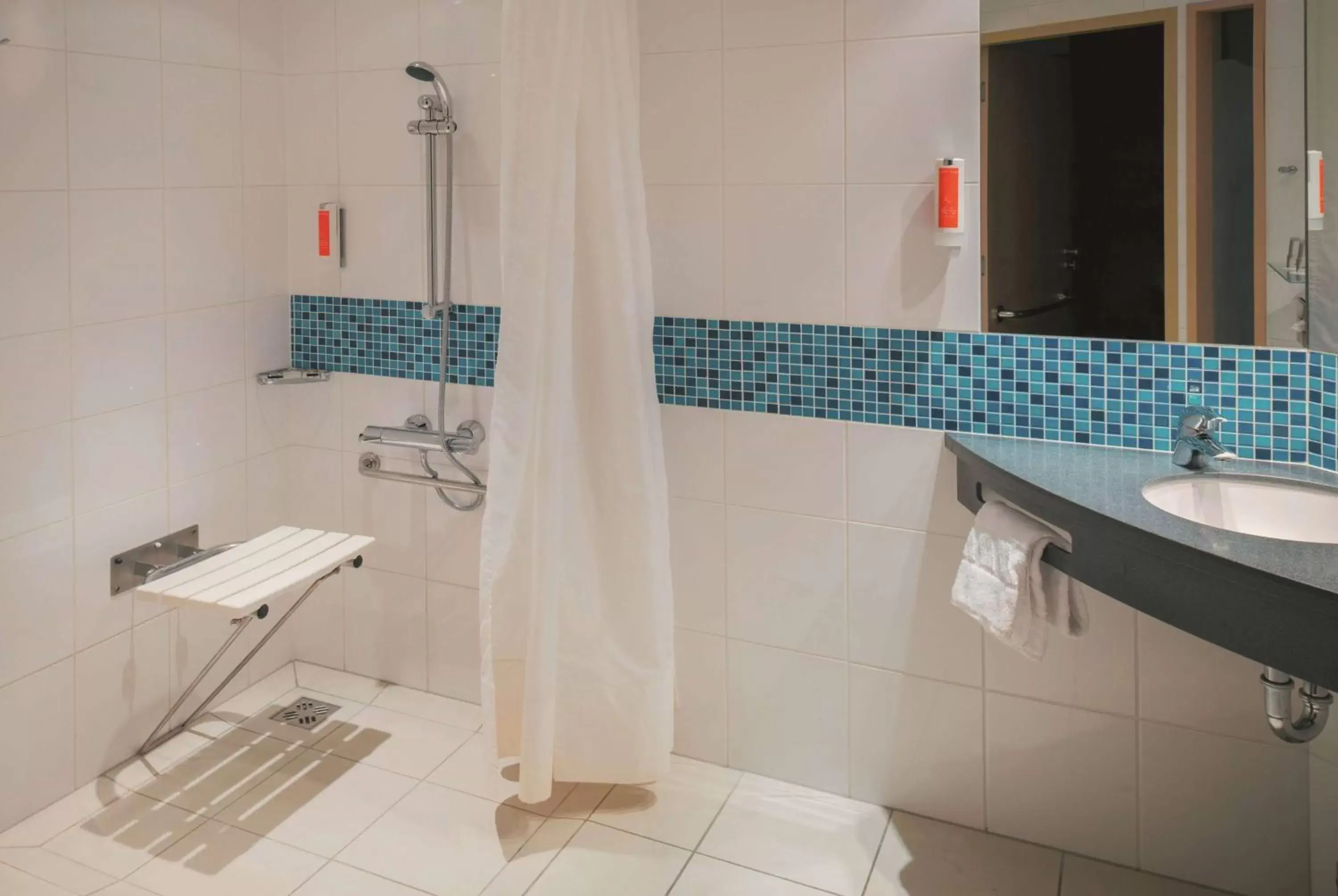 TV and multimedia, Bathroom in Vienna House Easy by Wyndham Bratislava