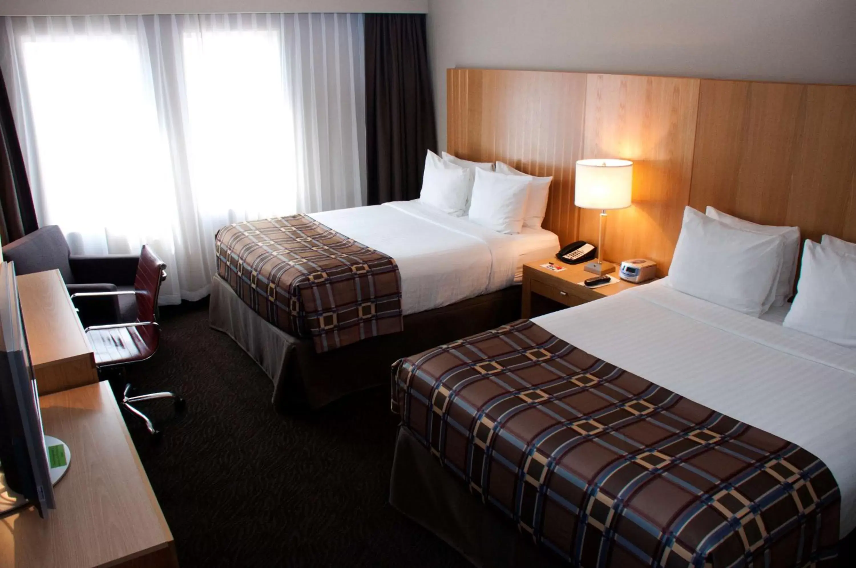 Photo of the whole room, Bed in Radisson Hotel & Suites Red Deer