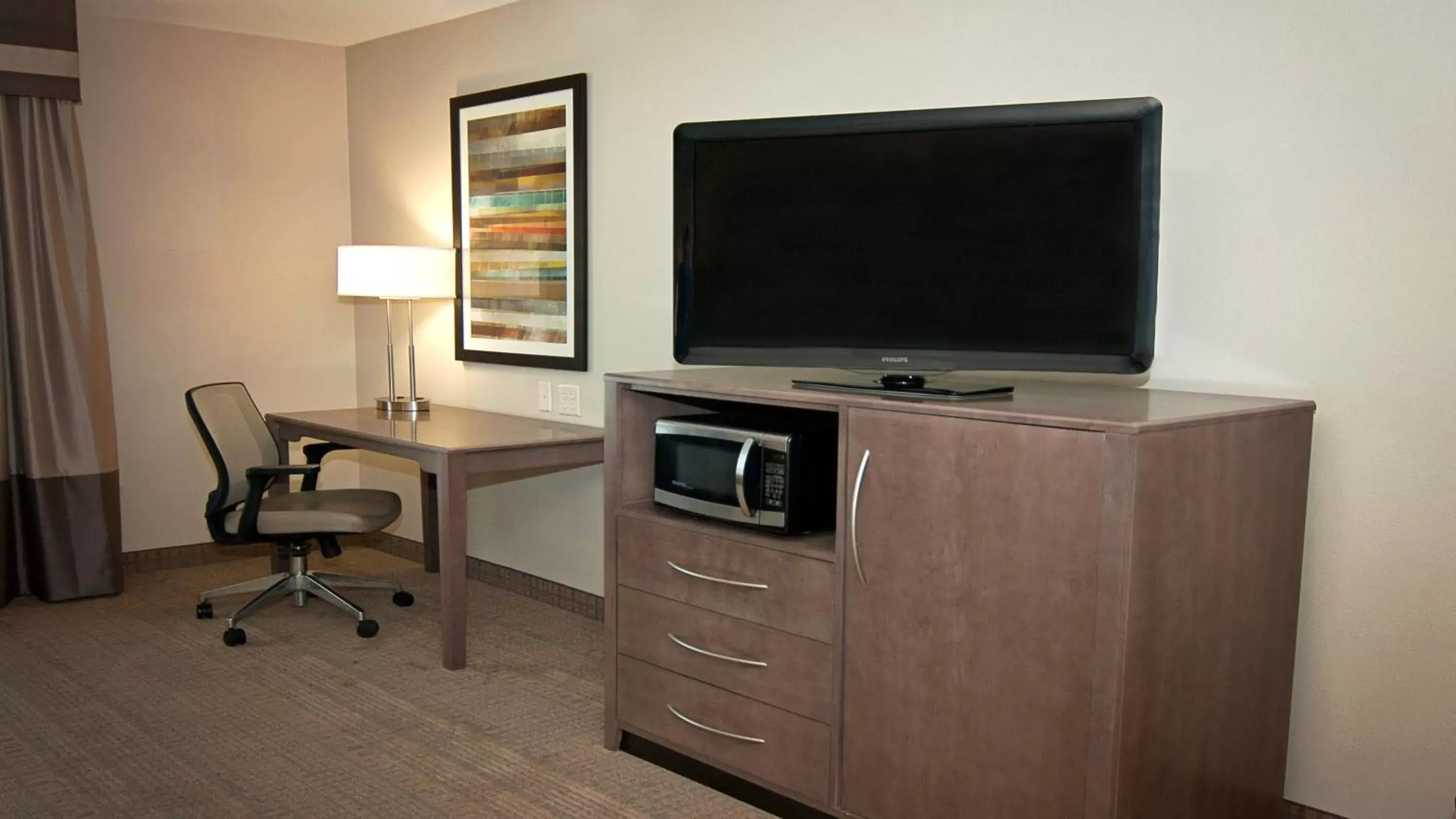 Photo of the whole room, TV/Entertainment Center in Holiday Inn Express Hotel & Suites Wichita Northeast, an IHG Hotel