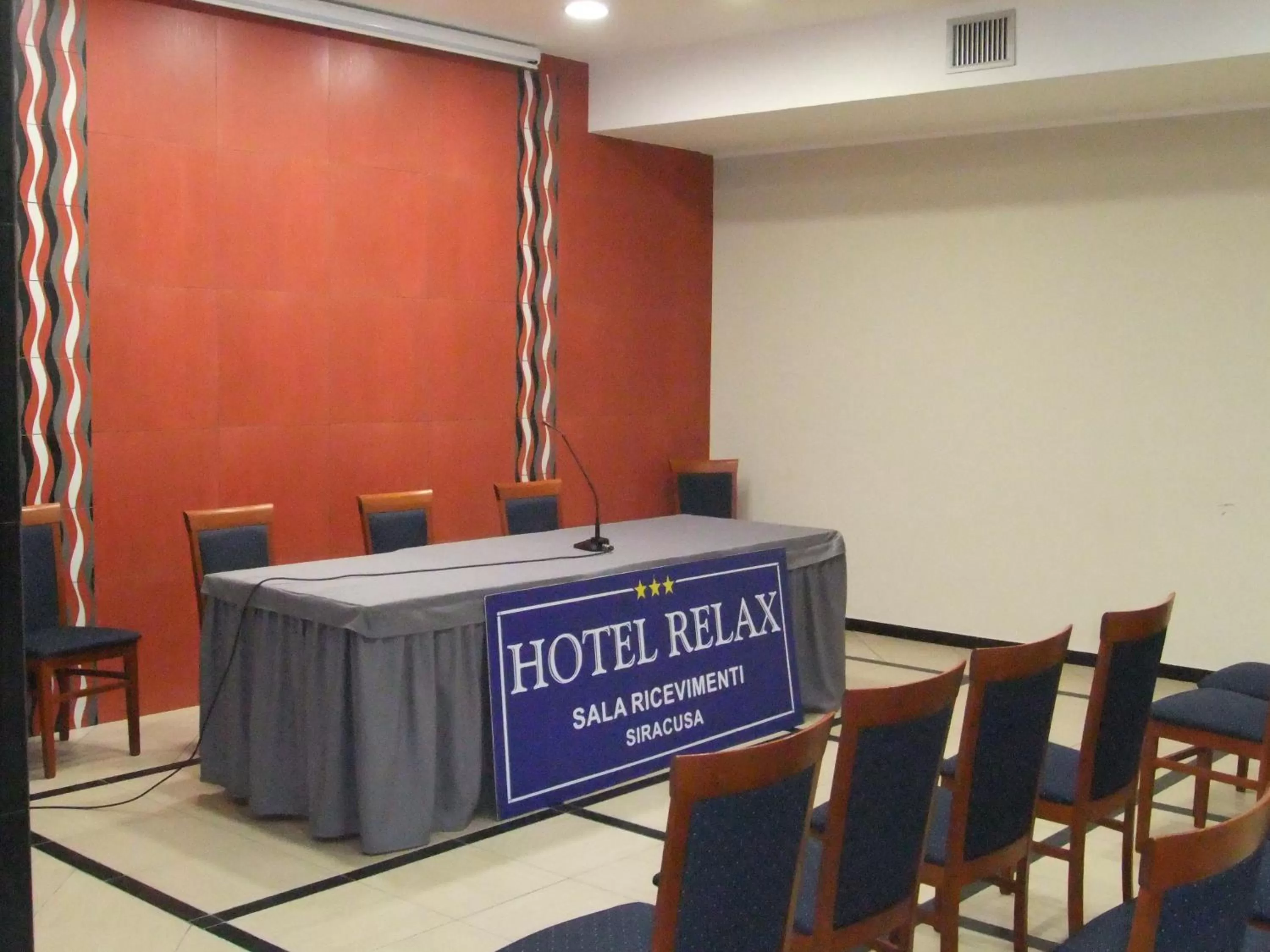 Property logo or sign in Hotel Relax