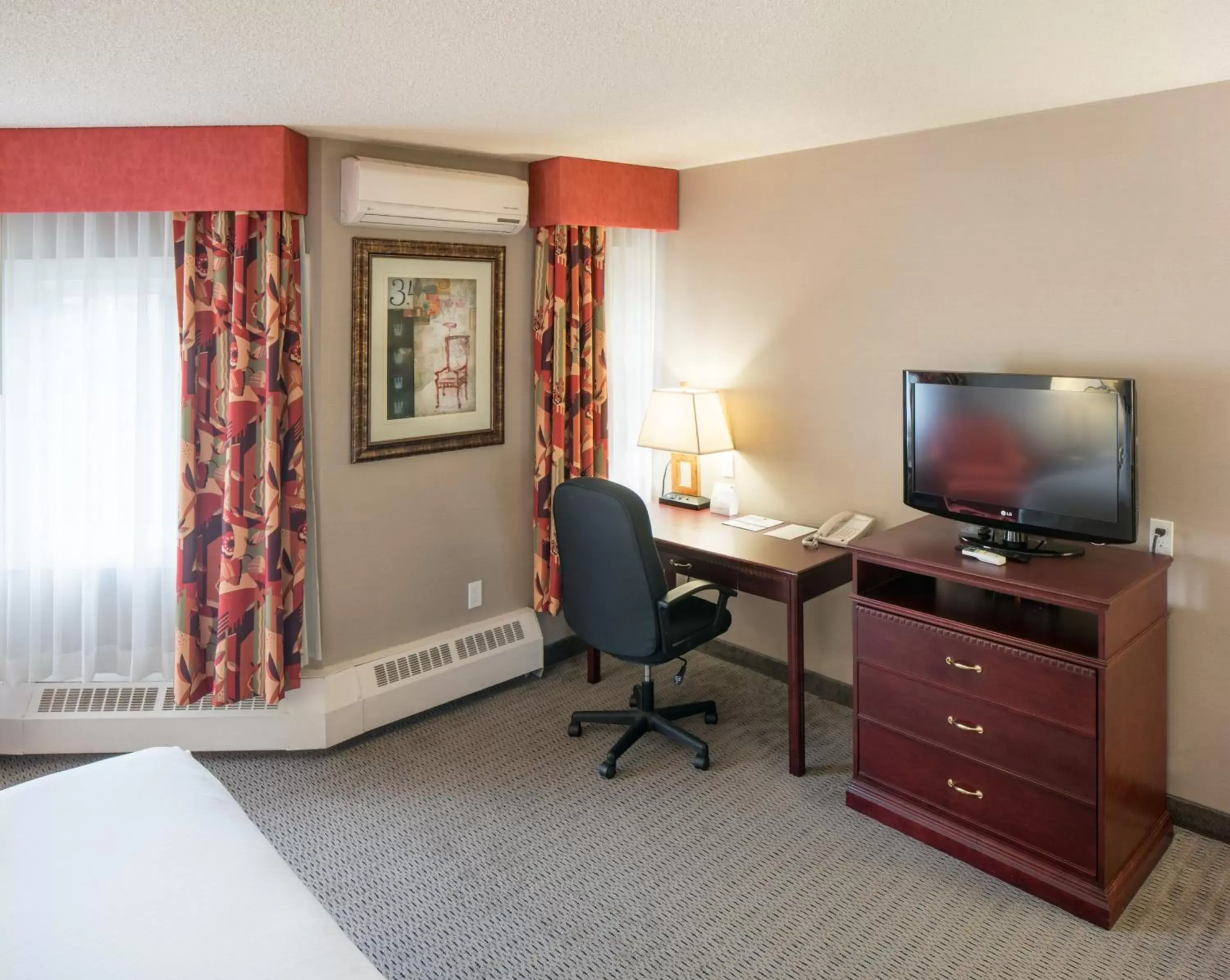 Photo of the whole room, TV/Entertainment Center in Holiday Inn Express Red Deer, an IHG Hotel