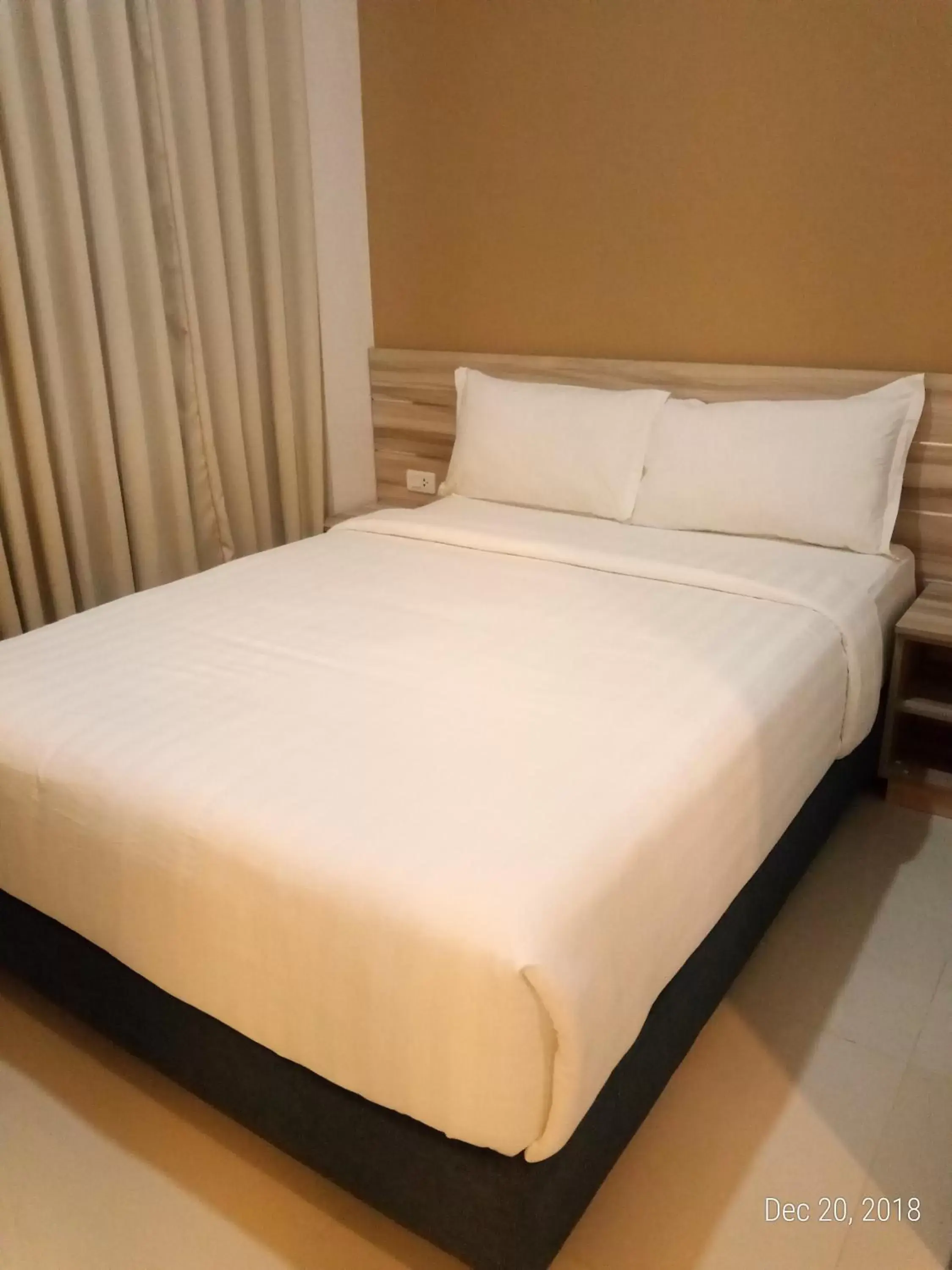 Bed in Figtree Hotel